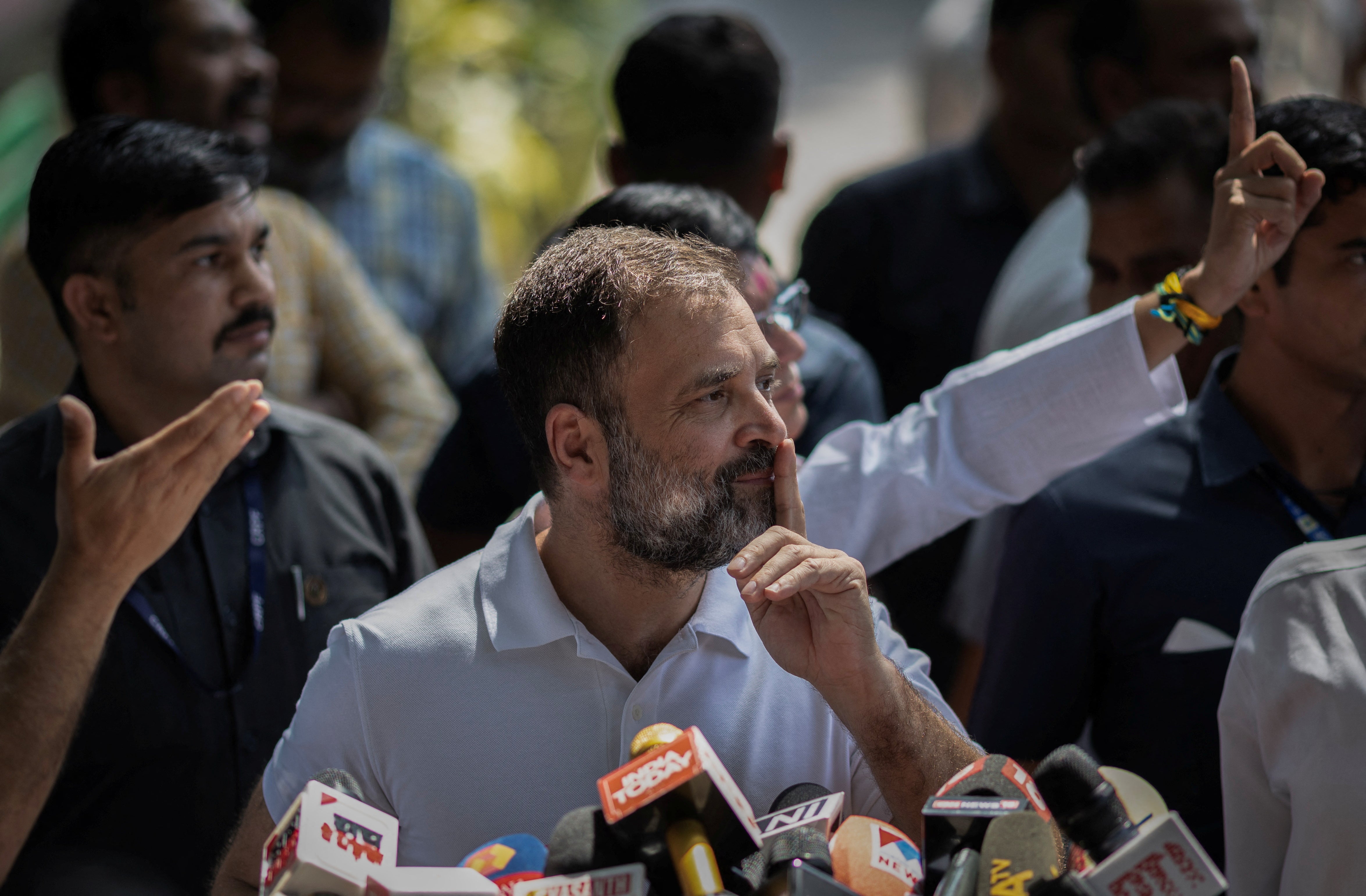 Rahul Gandhi, a senior leader of India's main opposition Congress party, gestures as he addresses the media