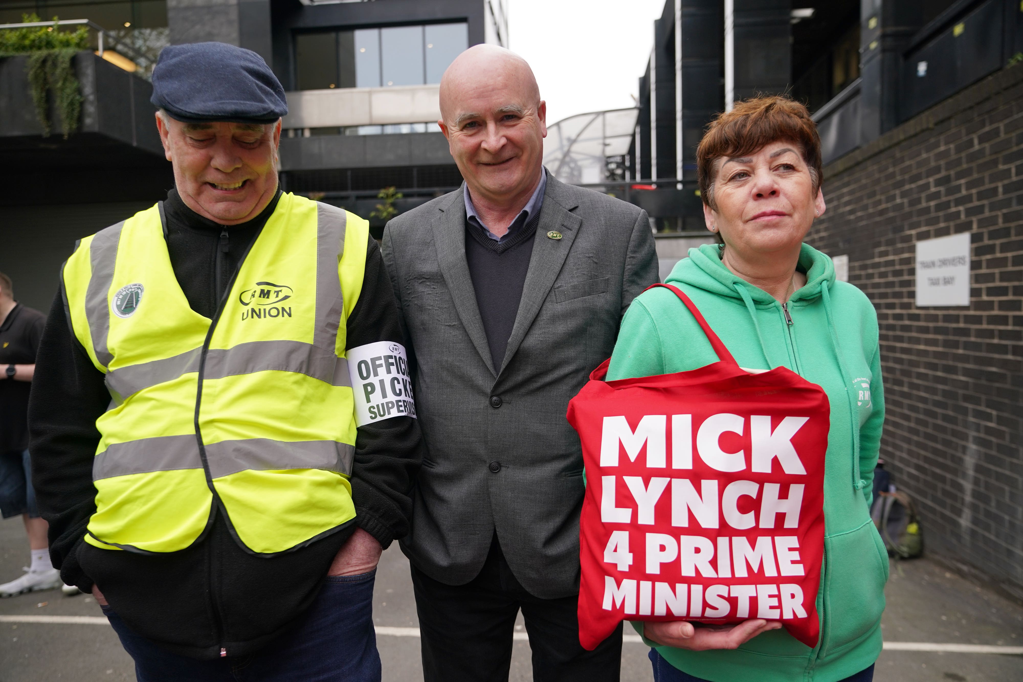 RMT general secretary Mick Lynch (centre) joins members of his union on the picket line outside Euston station (Yui Mok/PA)