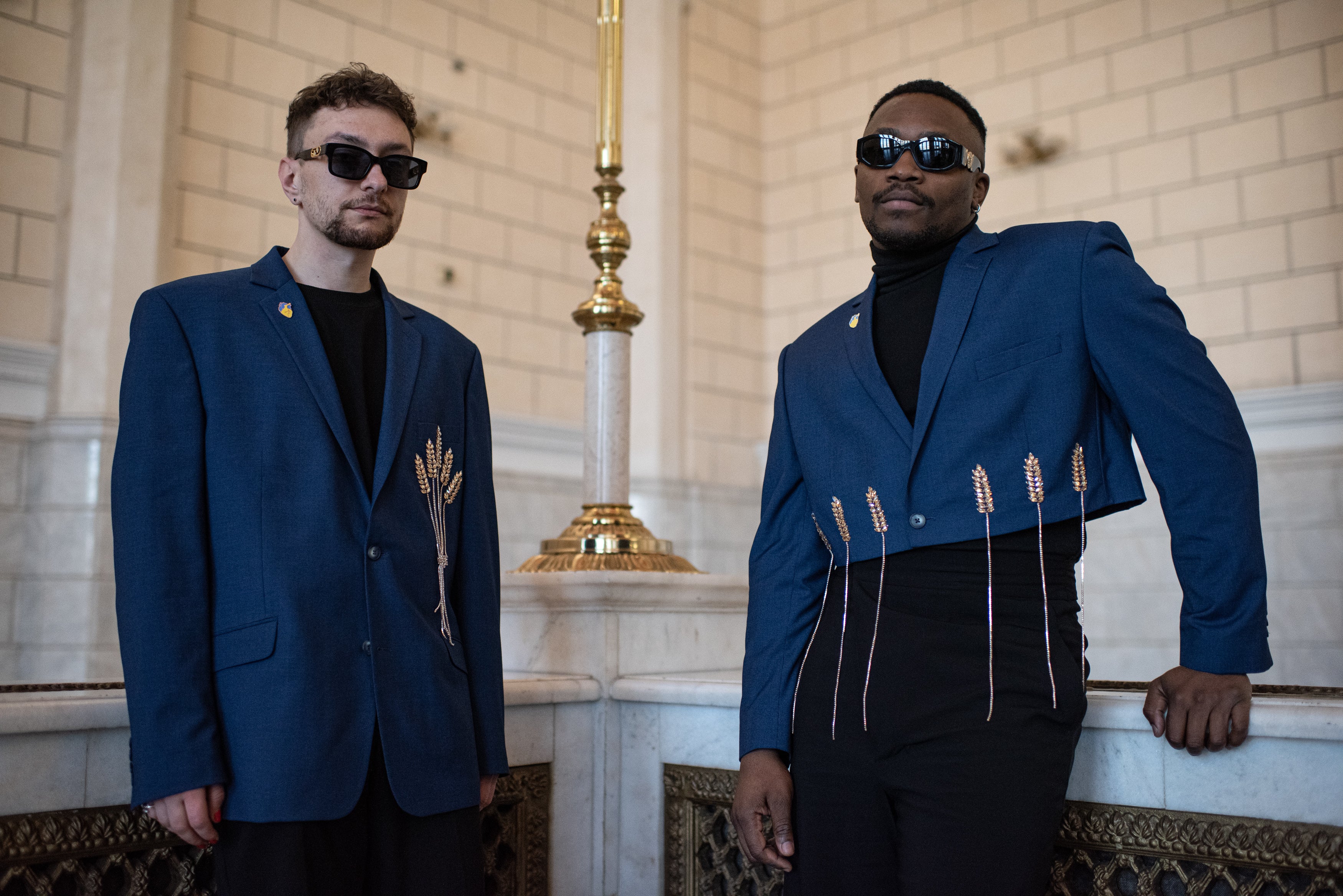 Jeffrey Kenny and Andrii Hutsuliak, members of the Tvorchi duo, pose for a portrait in the central Ukrainian railway station on April 28, 2023 in Kyiv, Ukraine