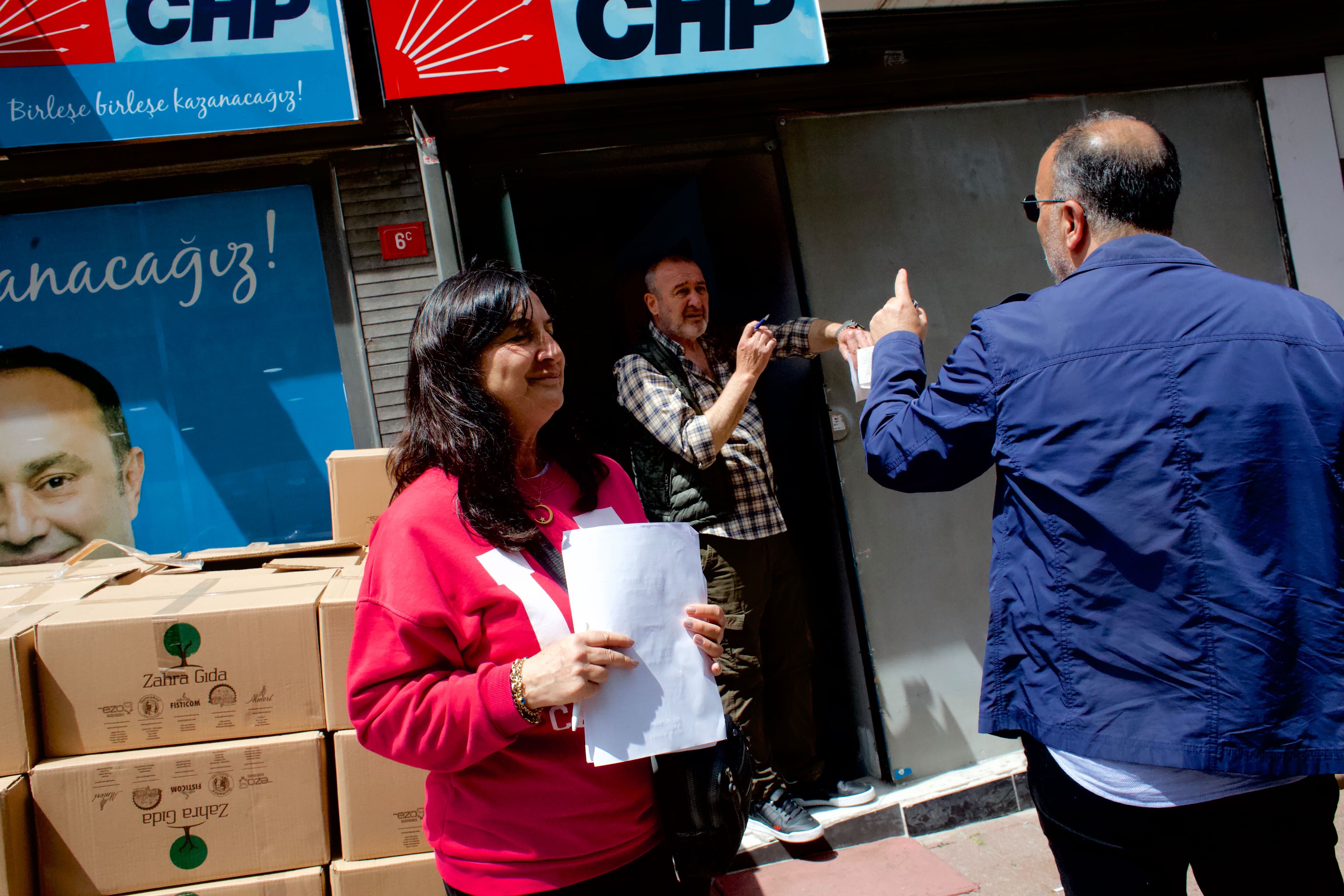 Opposition party official Cigdem Gulduval helps organize meals for poll workers