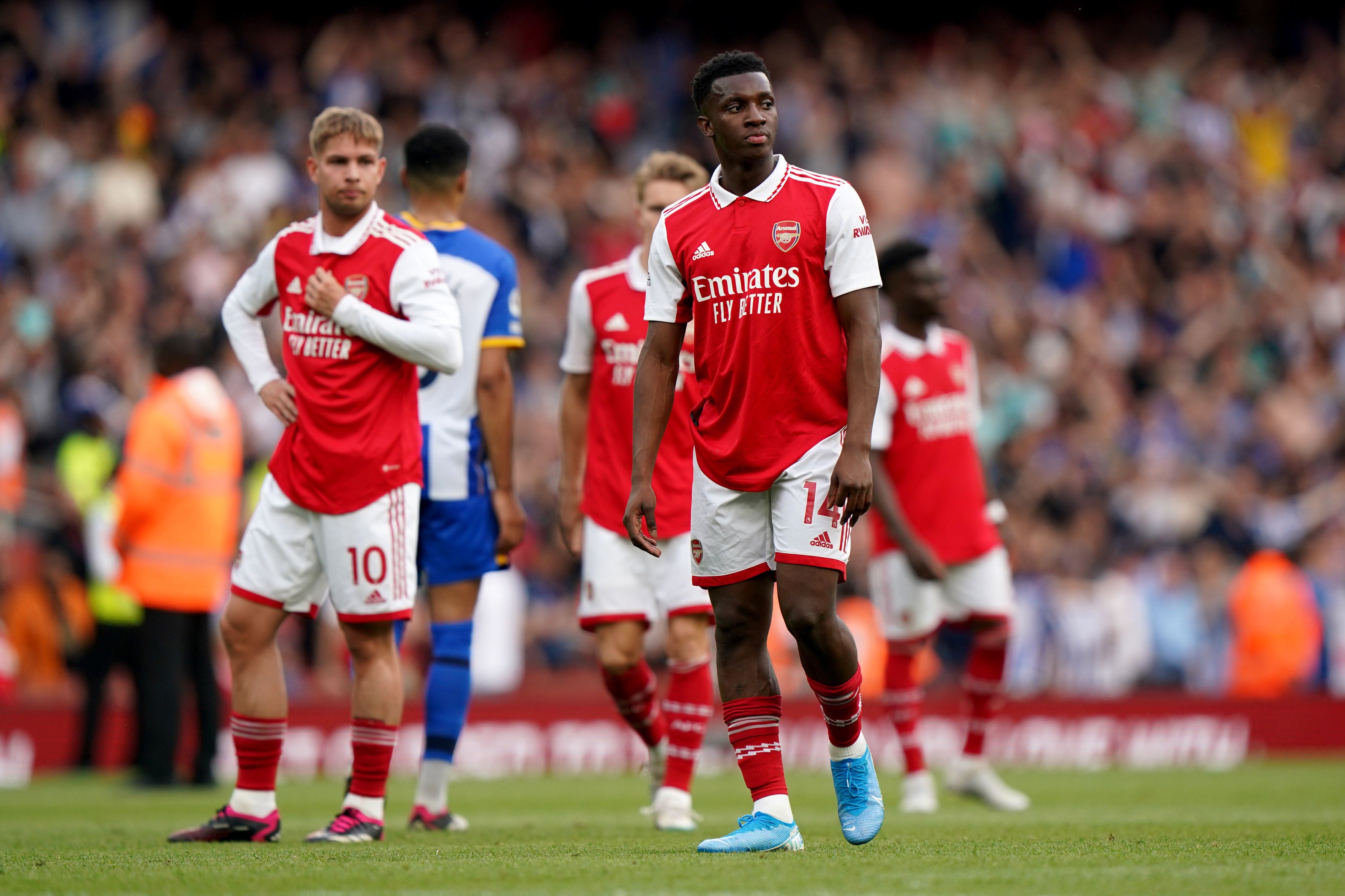 Arsenal players look dejected following the final whistle