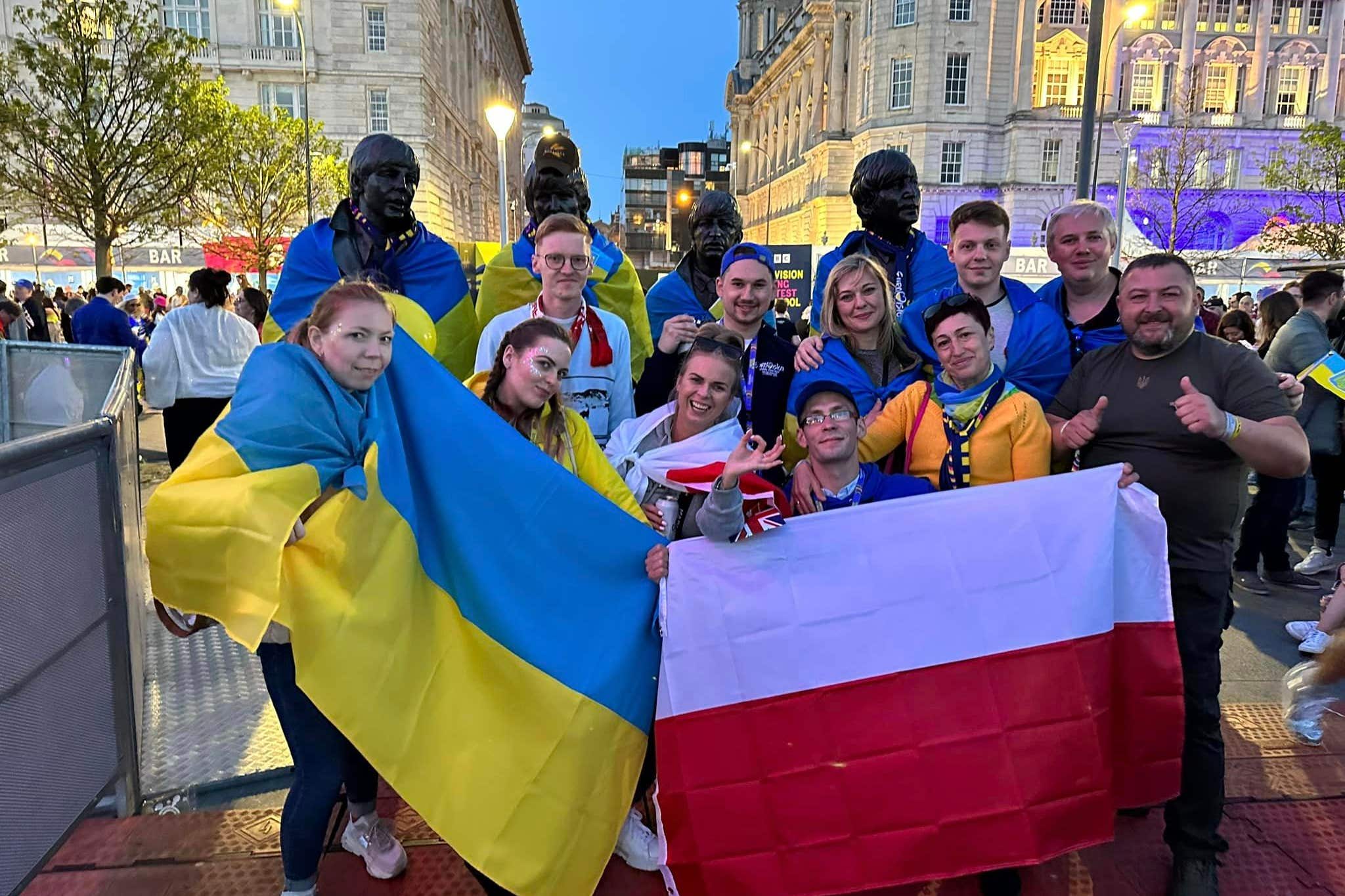 Ukrainian and Polish aid workers in the EuroVillage (Tim Johnson/PA)