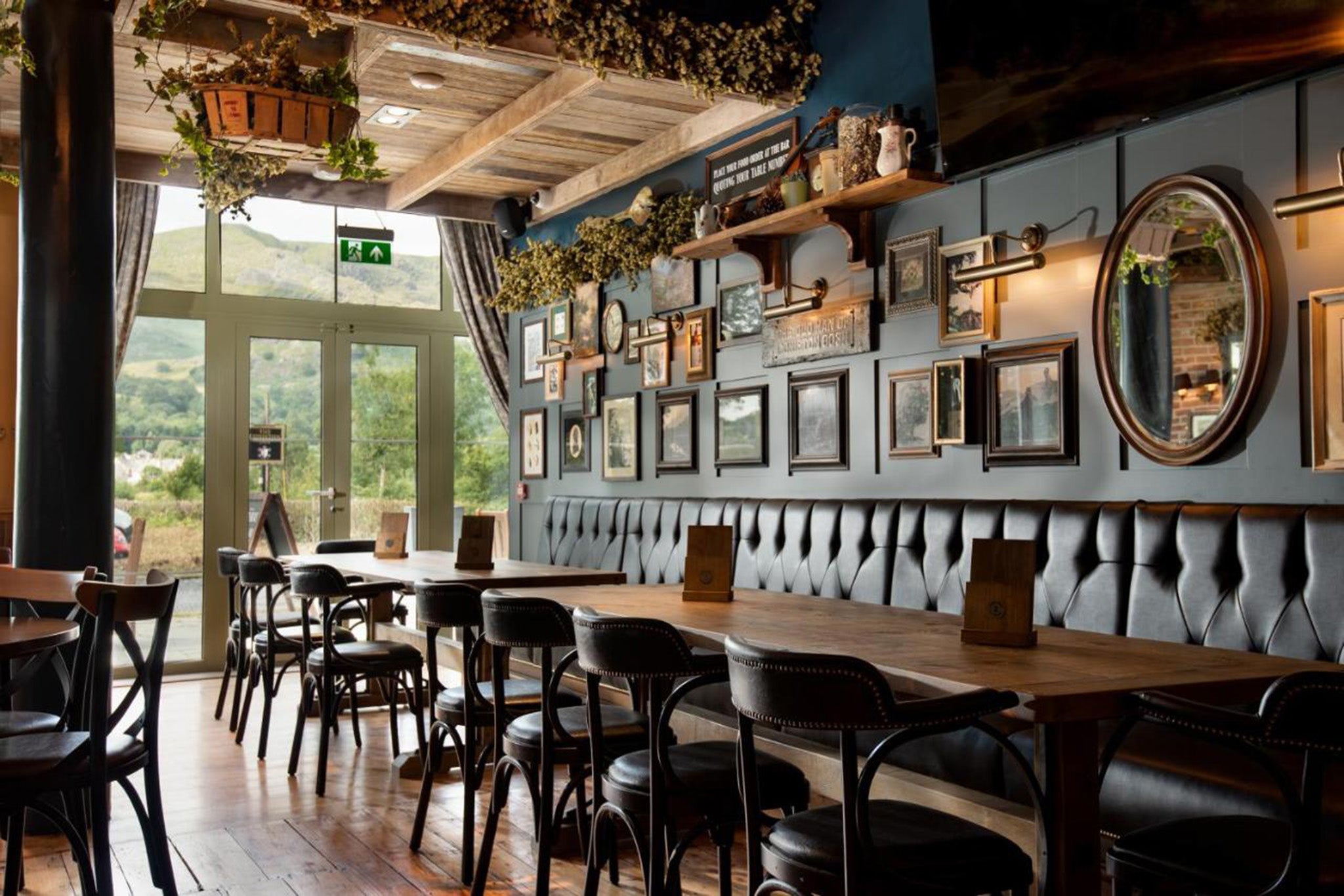 The pub has a cool country vibe, with leather sofas and antique artworks