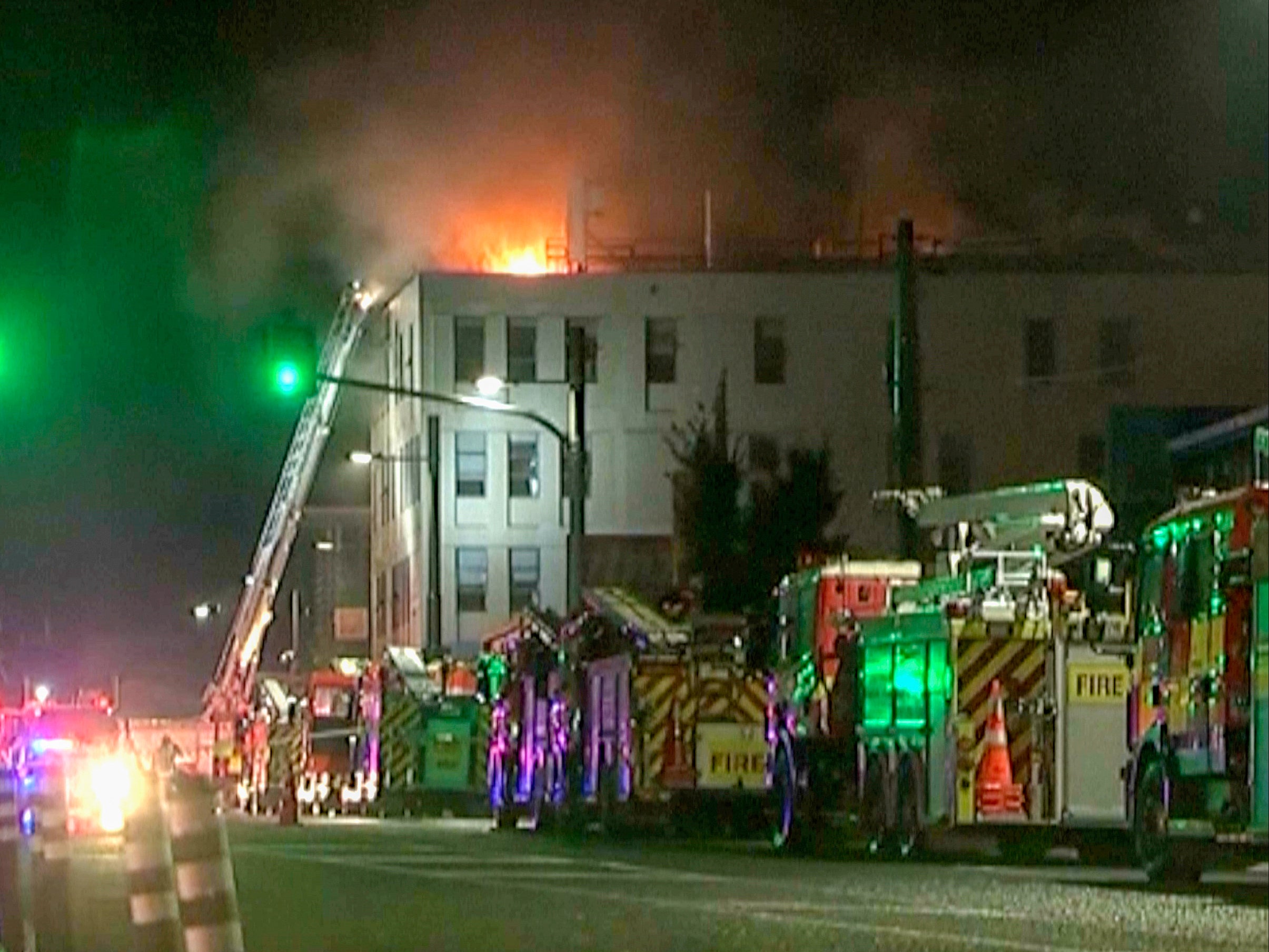 Fire engines gather outside the Loafers Lodge hostel in Wellington, New Zealand on Tuesday 16 May 2023