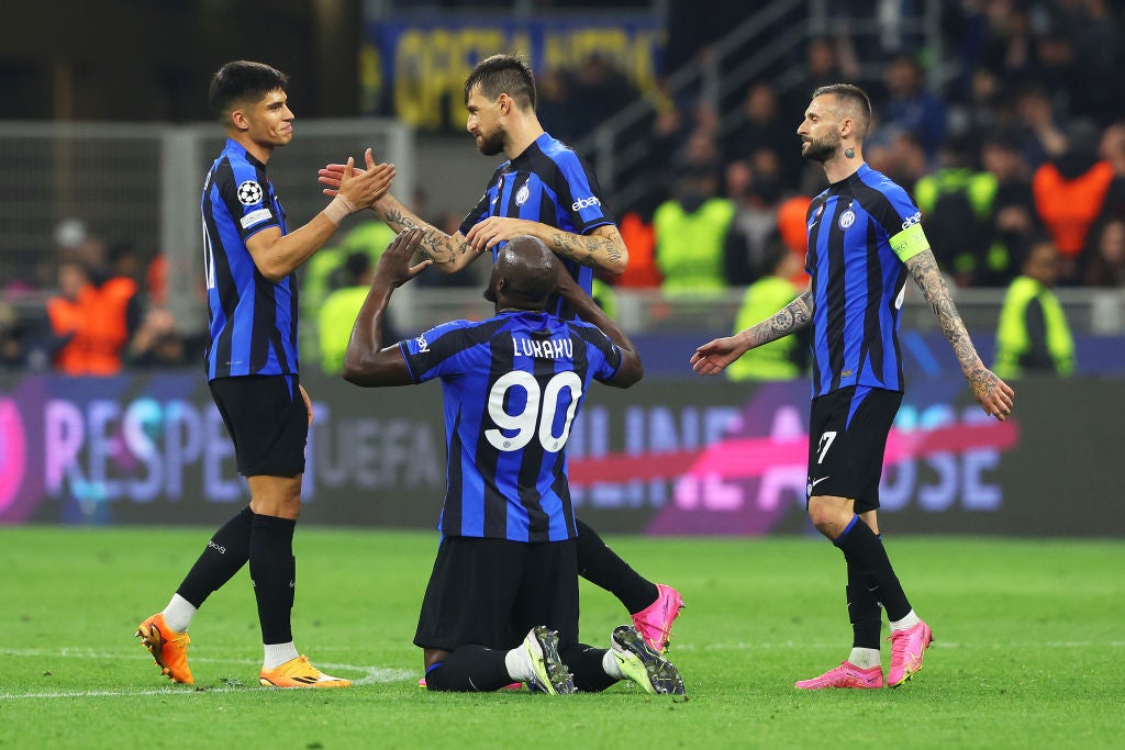 Inter players embrace after reaching the Champions League final