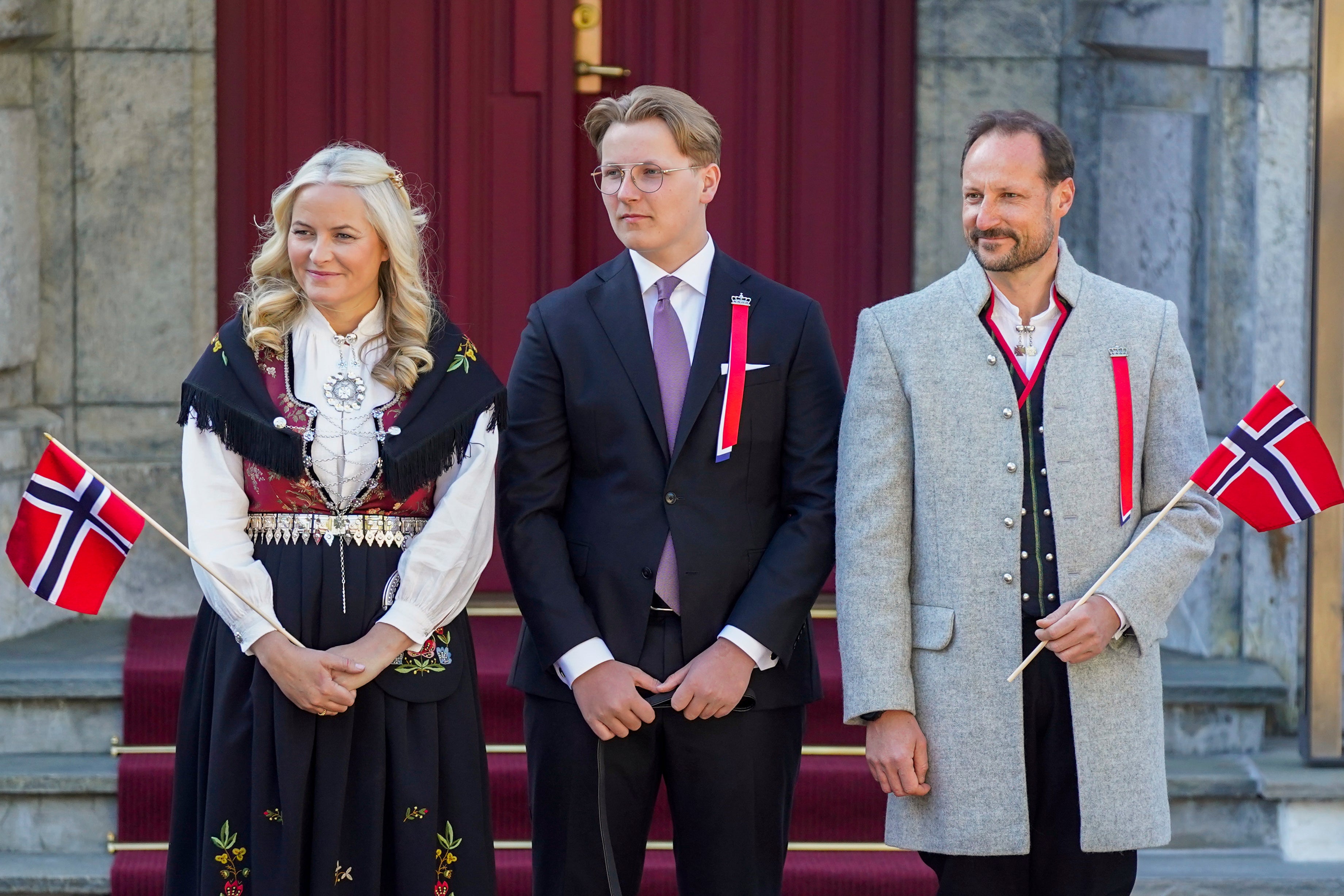 From left, Norway’s Crown Princess Mette-Marit, Prince Sverre Magnus and Crown Prince Haakon watch a parade