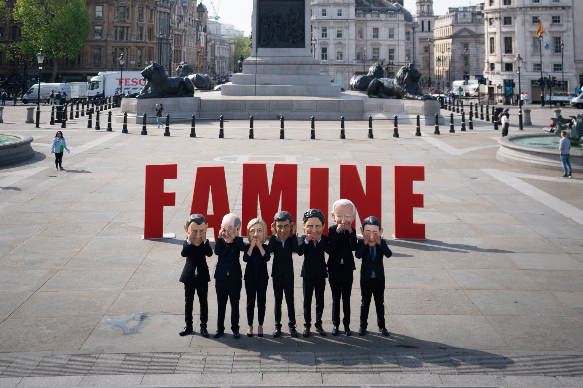 Oxfam activists wearing “big heads” of G7 leaders during a demonstration in Trafalgar Square (James Manning/PA)