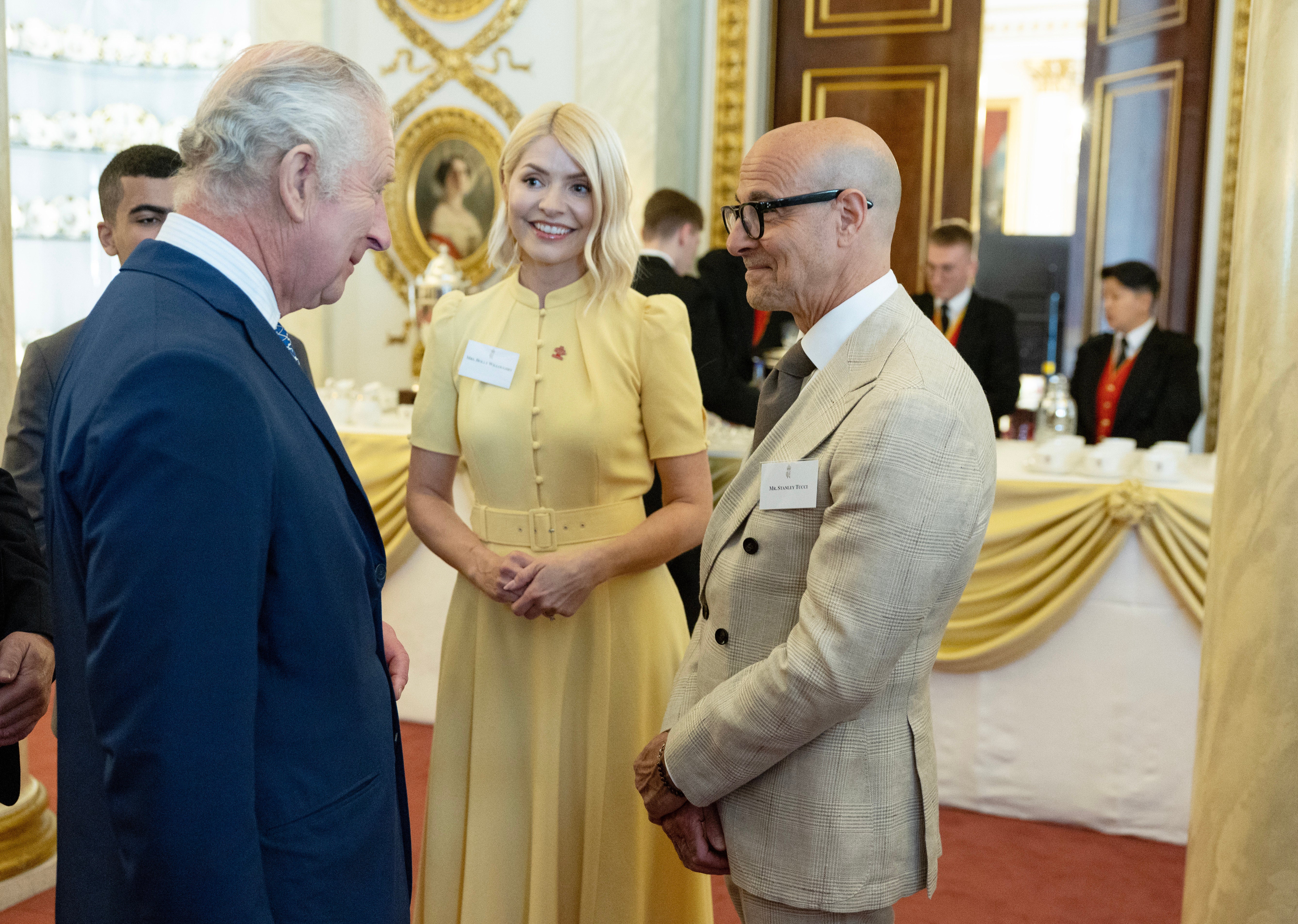 King Charles III meets Holly Willoughby and Stanley Tucci and he hosts the winners of the Prince's Trust awards and celebrity ambassadors at Buckingham Palace on May 17, 2023