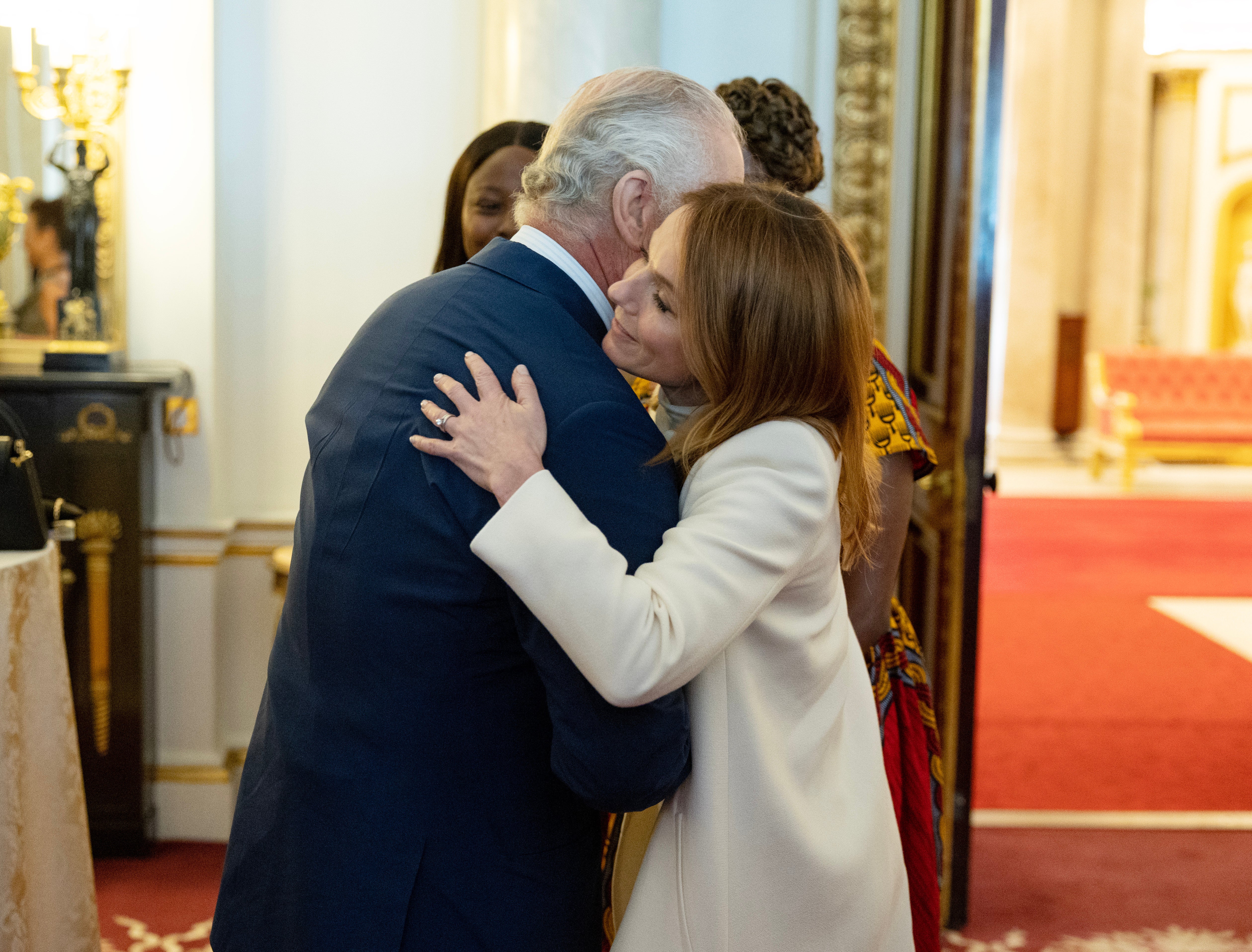 King Charles III meets Geri Horner as he hosts the winners of the Prince's Trust awards and celebrity ambassadors at Buckingham Palace on May 17, 2023