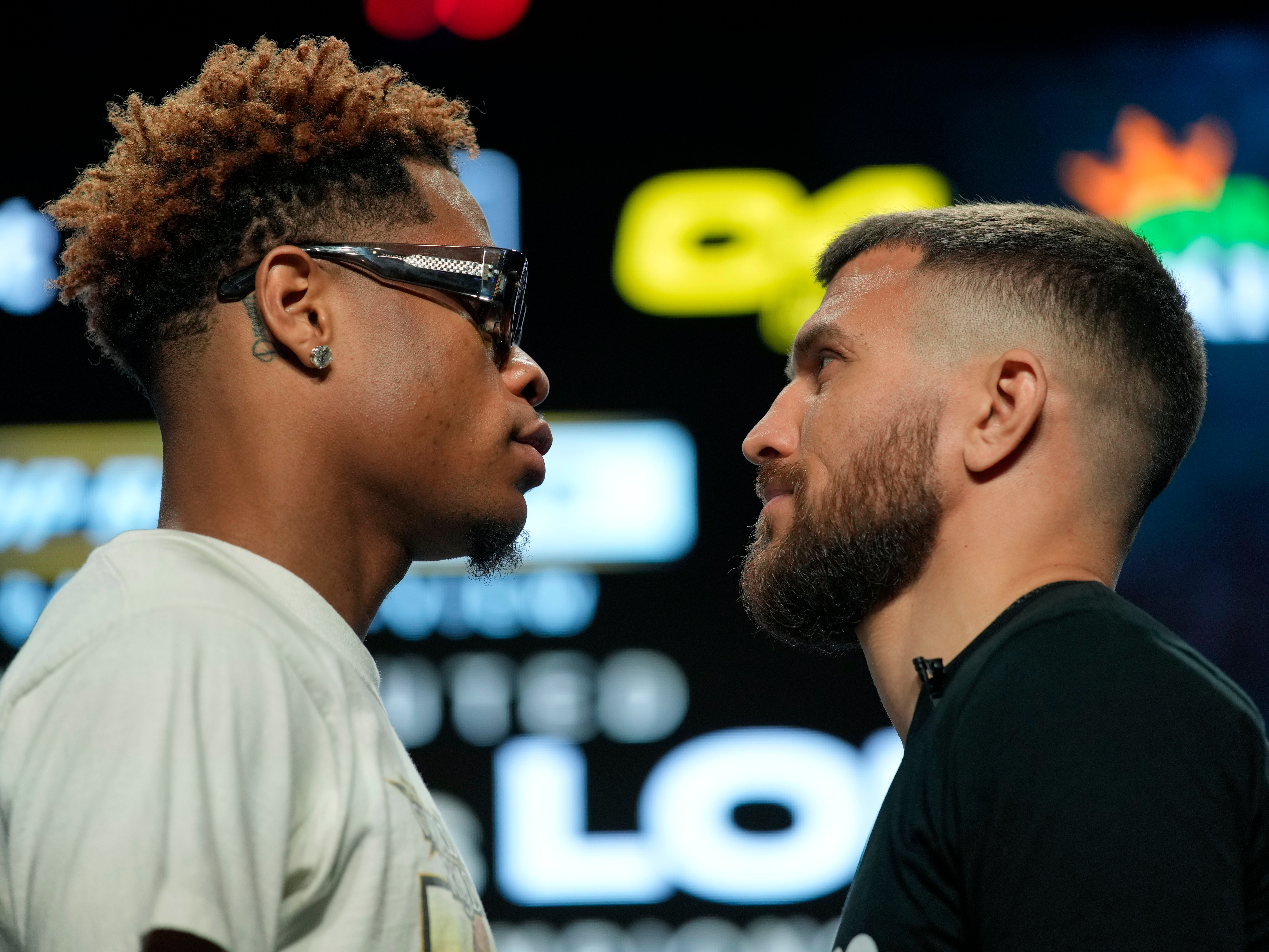 Devin Haney (left) faces off with Vasiliy Lomachenko ahead of their title fight