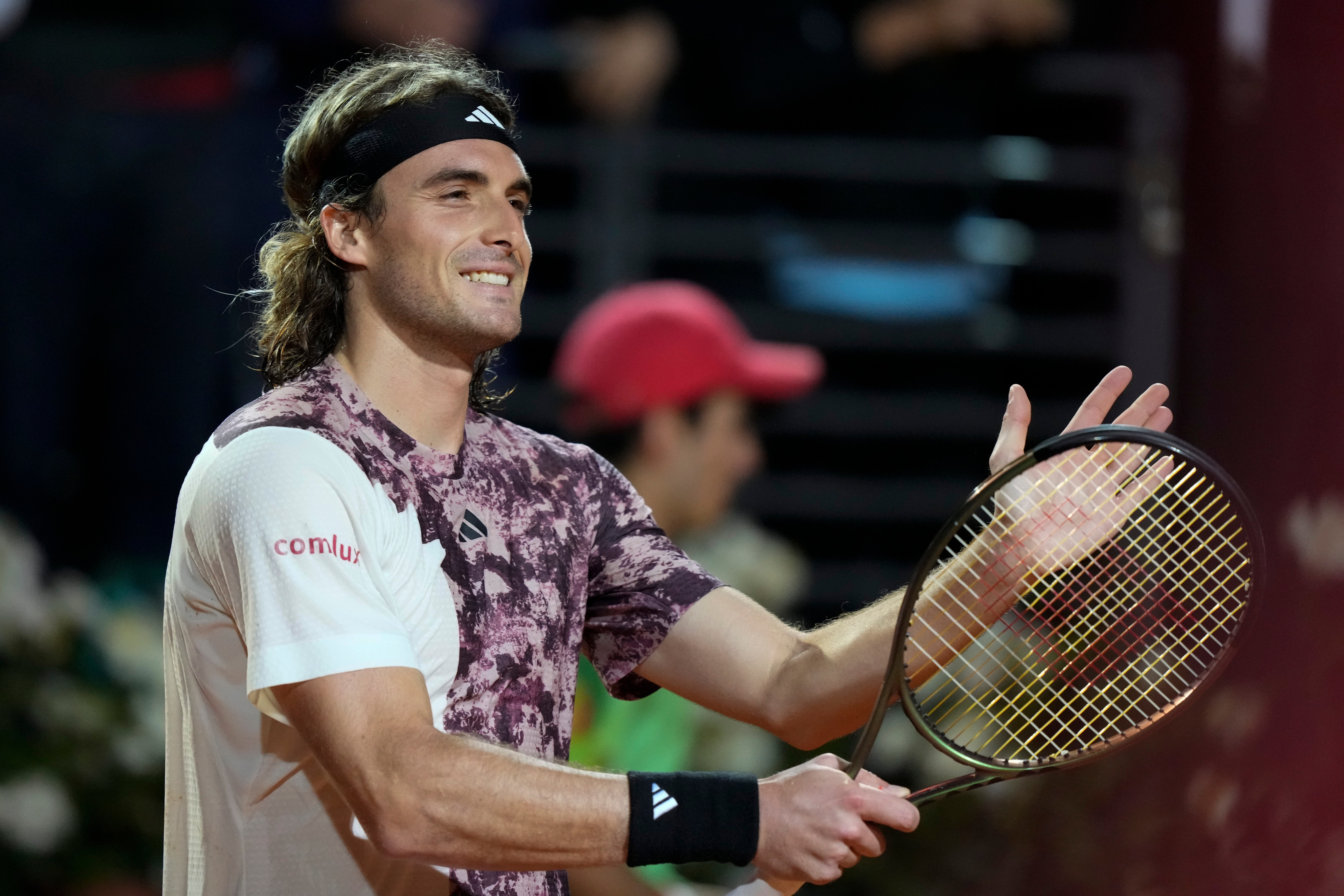 Stefanos Tsitsipas celebrates after defeating Borna Coric (Andrew Medichini/AP)