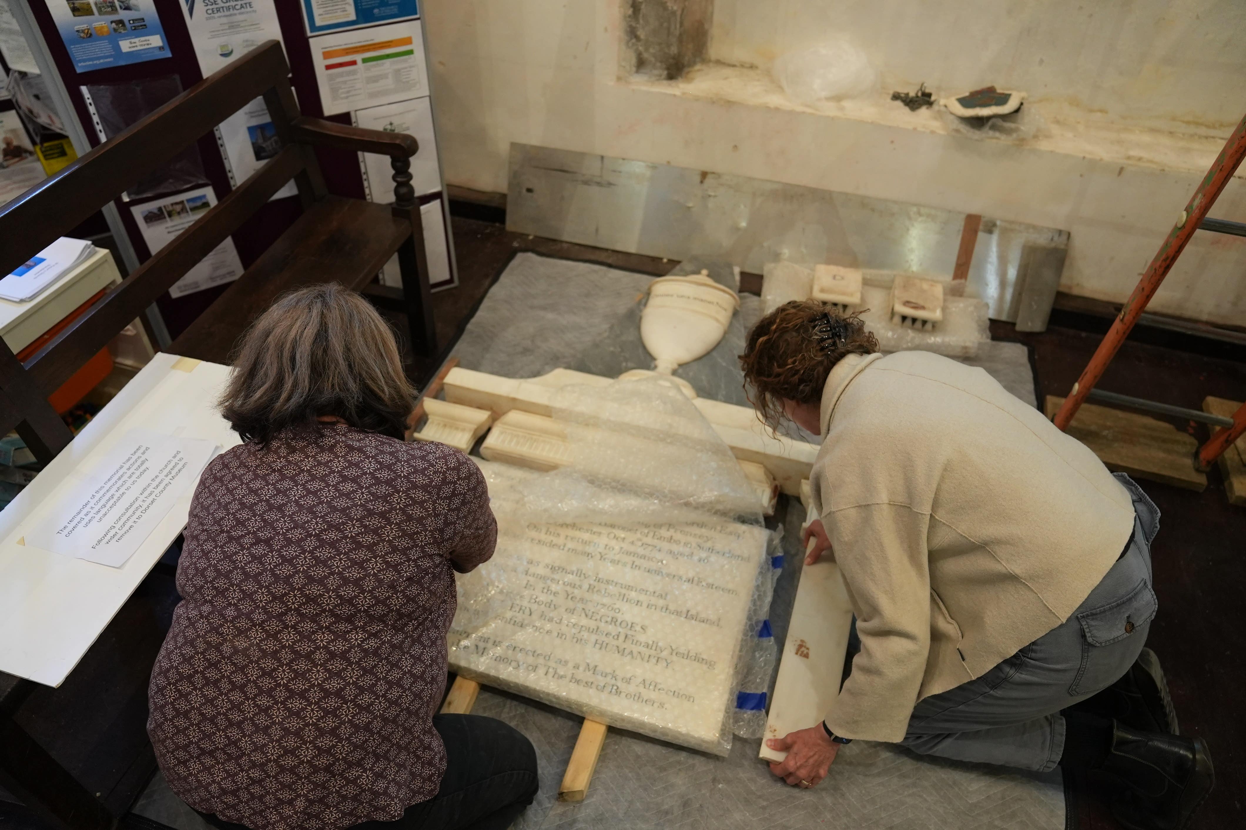 The plaque to John Gordon is removed from St Peter’s Church in Dorchester, Dorset (Dorset Media Services/Diocese of Salisbury/PA)