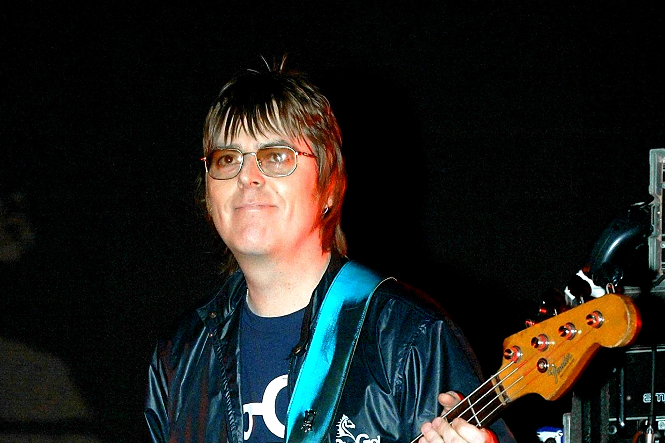 Andy Rourke on stage with Badly Drawn Boy during the Manchester Versus Cancer charity concert in 2006 (PA)