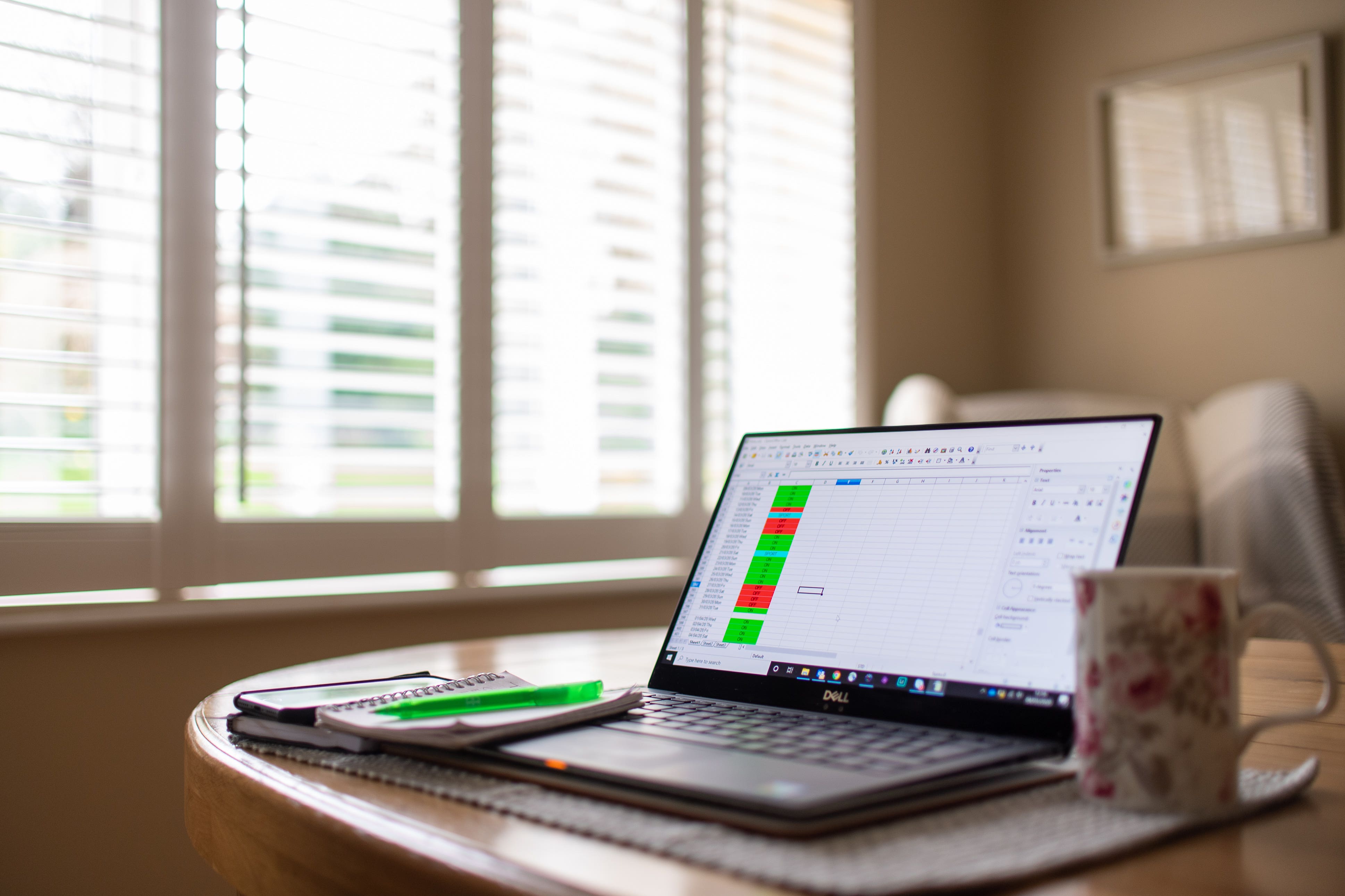 A laptop on a dining room table set up as a remote office (Joe Giddens/PA)