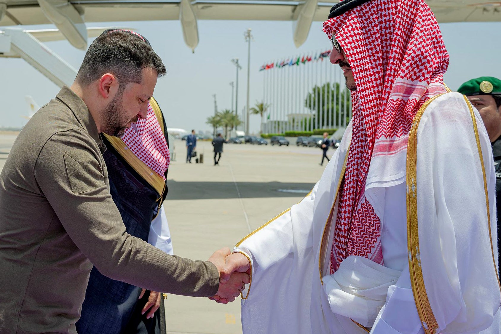 Deputy Emir of Mecca Prince Badr bin Sultan bin Abdulaziz (R) welcoming Ukraine's President Volodymyr Zelensky