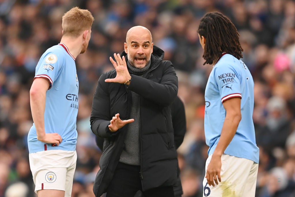 Pep Guardiola directs his players from the touchline