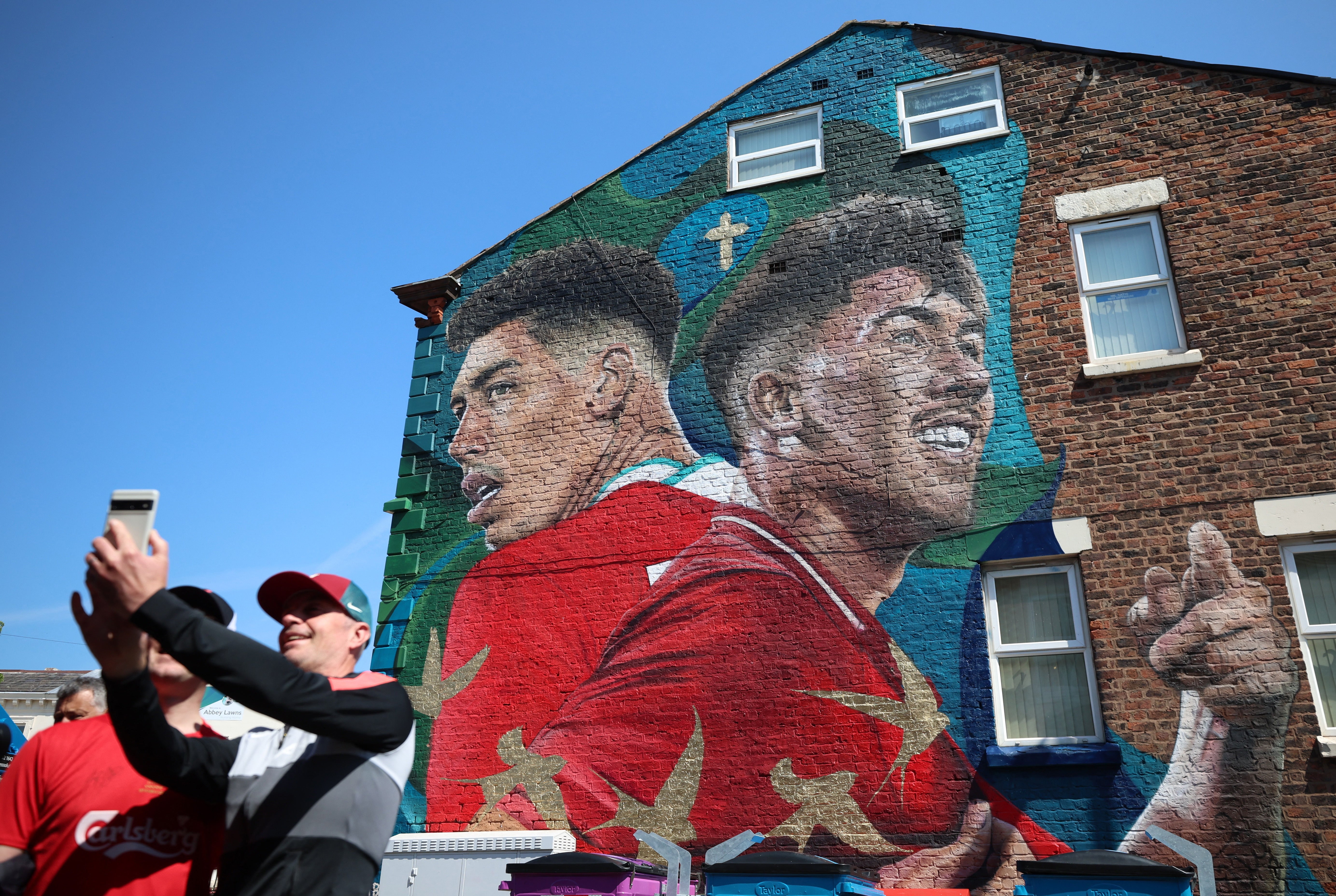 A mural celebrating Roberto Firmino outside Anfield