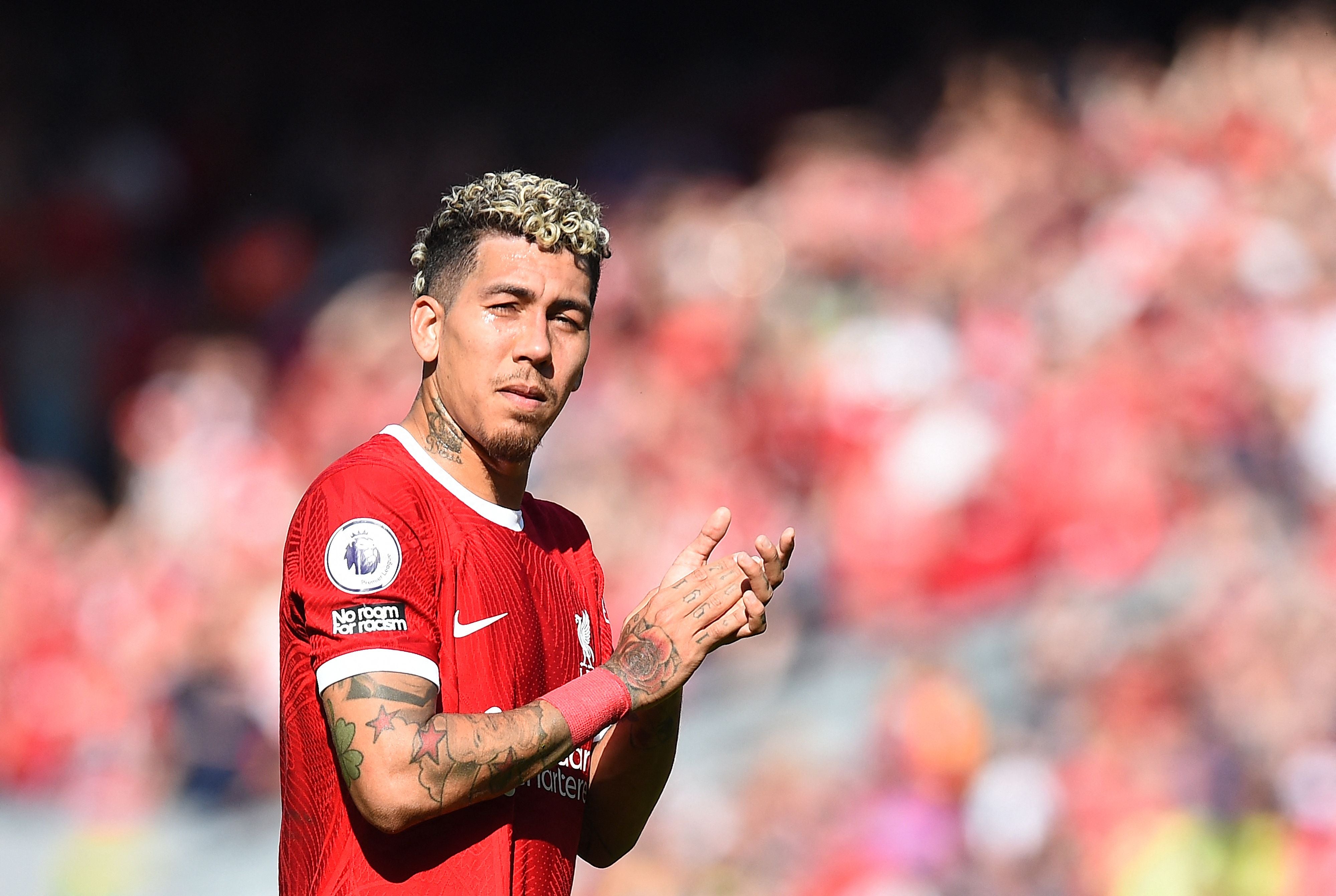 Roberto Firmino applauds the Liverpool fans at full-time