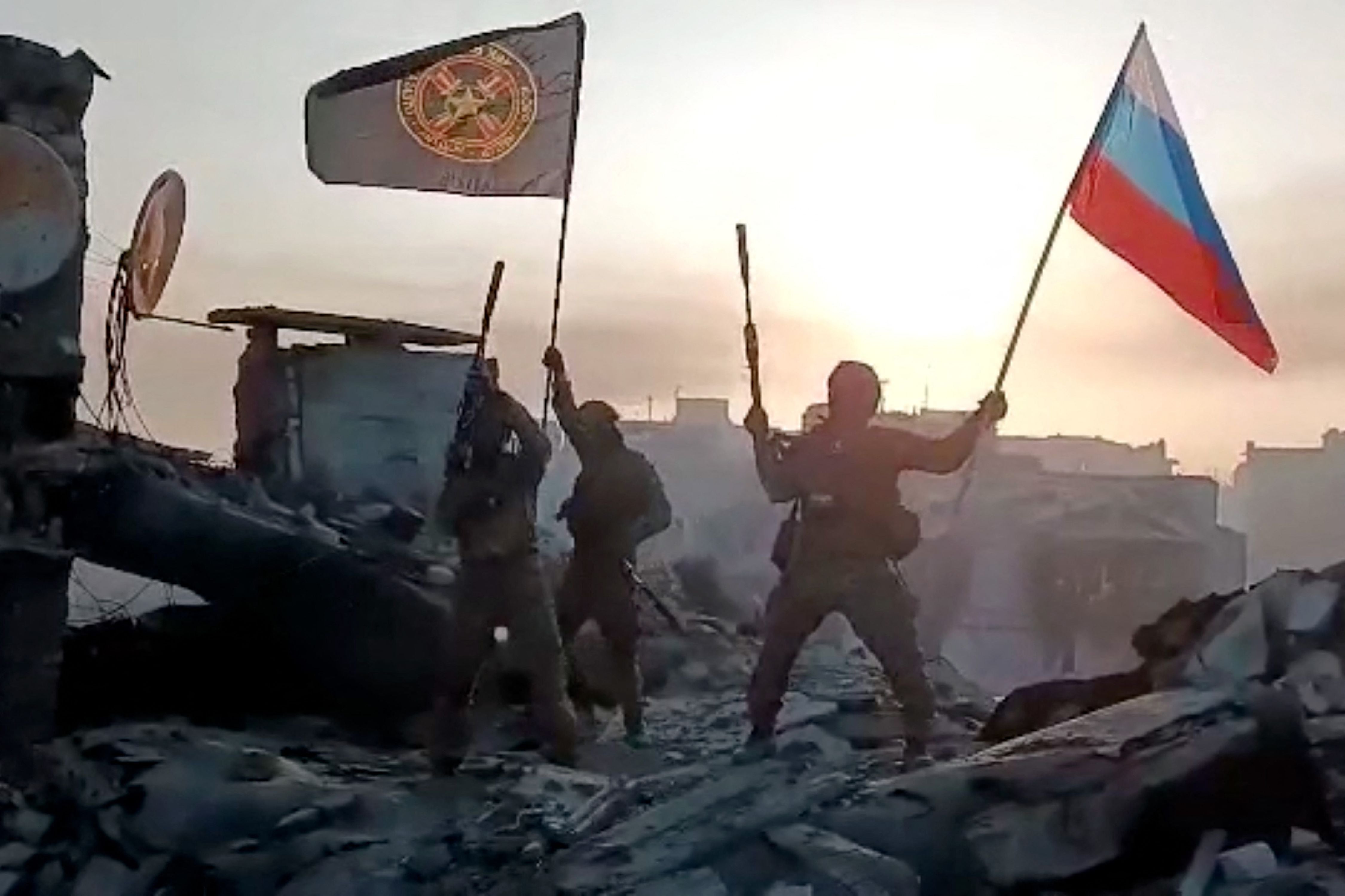 Members of Wagner group waving a Russian national flag in Bakhmut