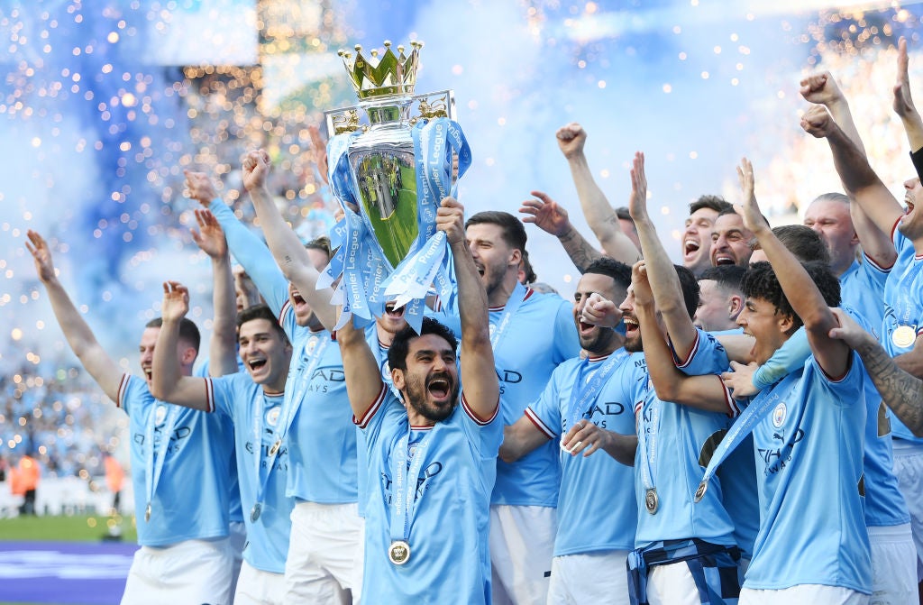 City captain Ilkay Gundogan lifts the title