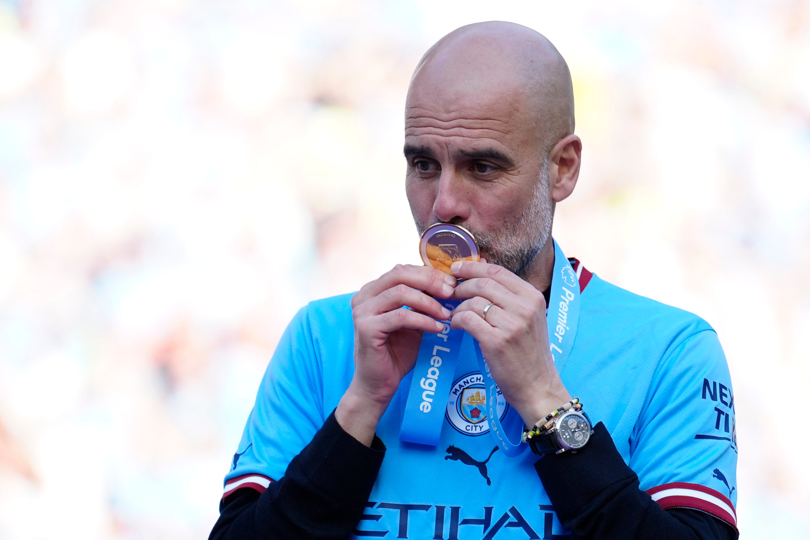 Manchester City’s head coach Pep Guardiola celebrates Premier League title after the English Premier League soccer match between Manchester City and Chelsea at the Etihad Stadium in Manchester, England, Sunday, May 21, 2023. (AP Photo/Jon Super)