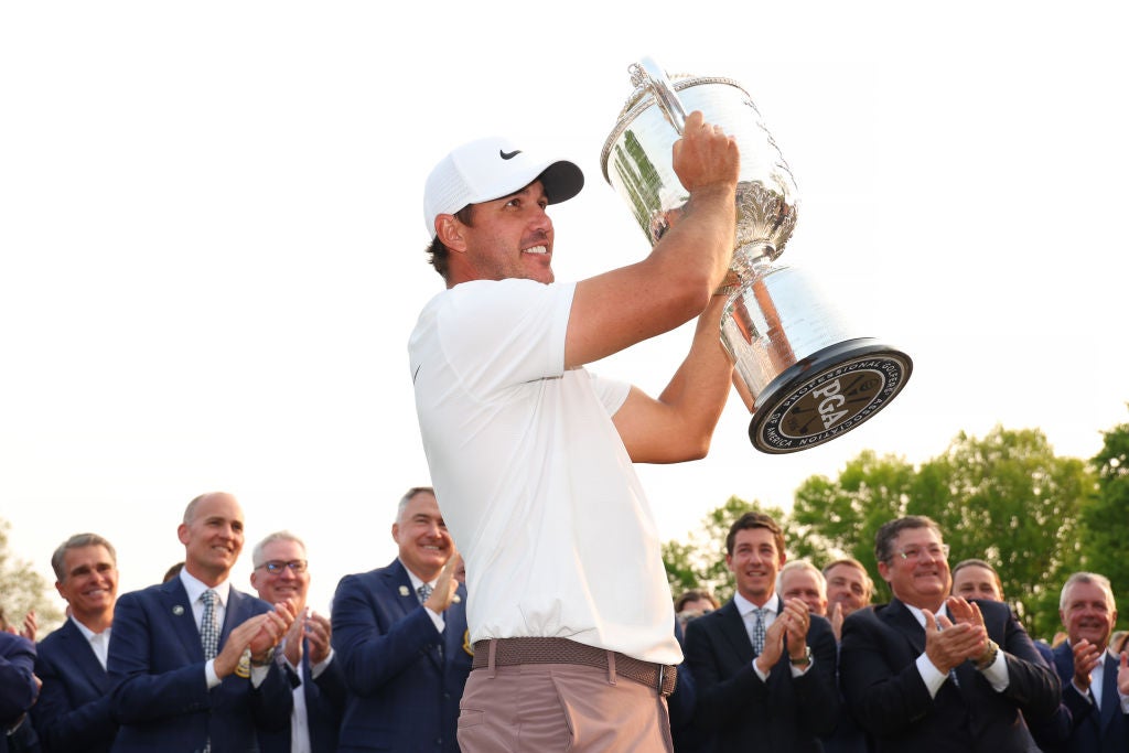 Brooks Koepka celebrates on the 18th green at Oak Hill