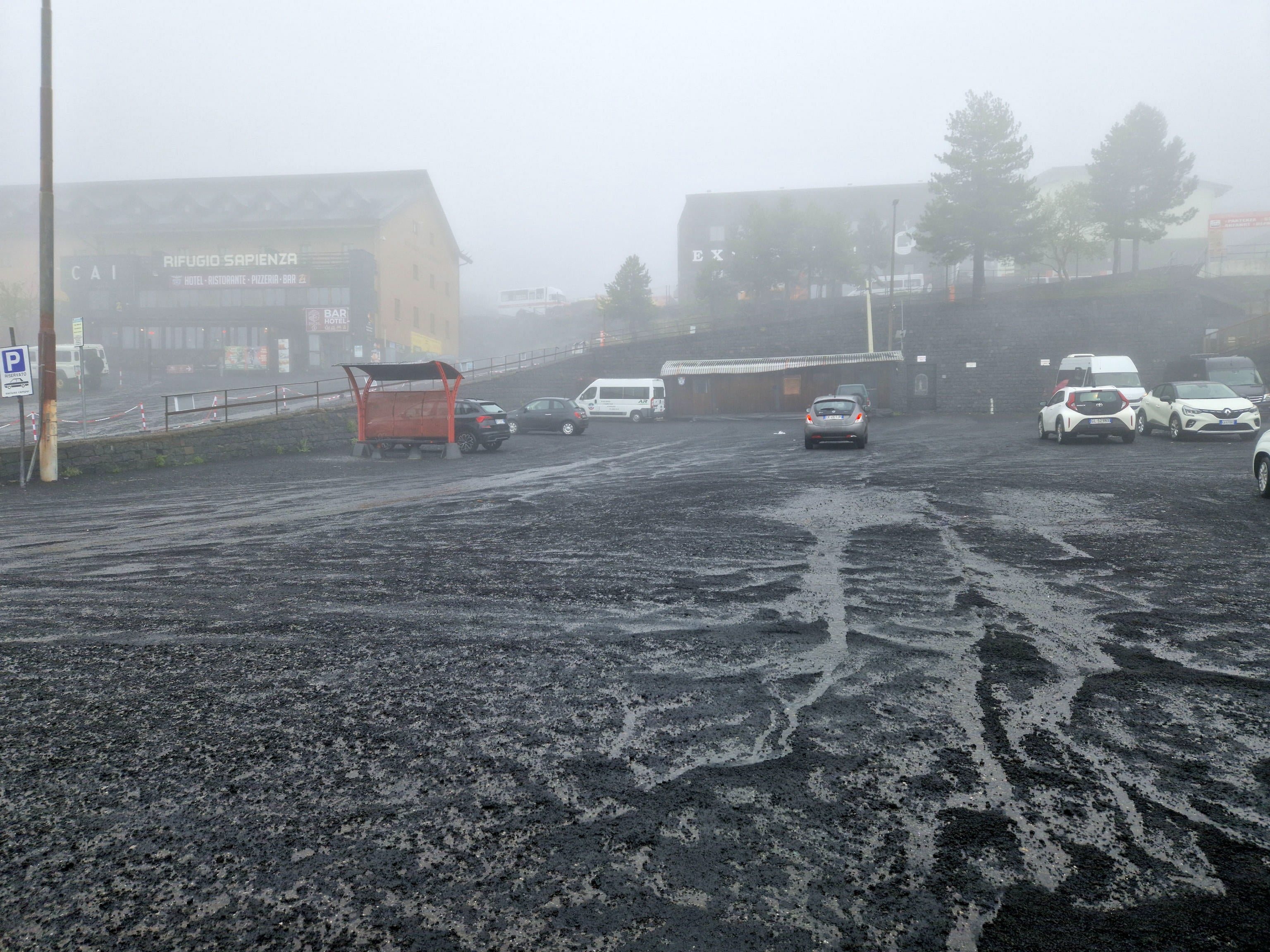 A thick layer of ash coats a public square in Sicily