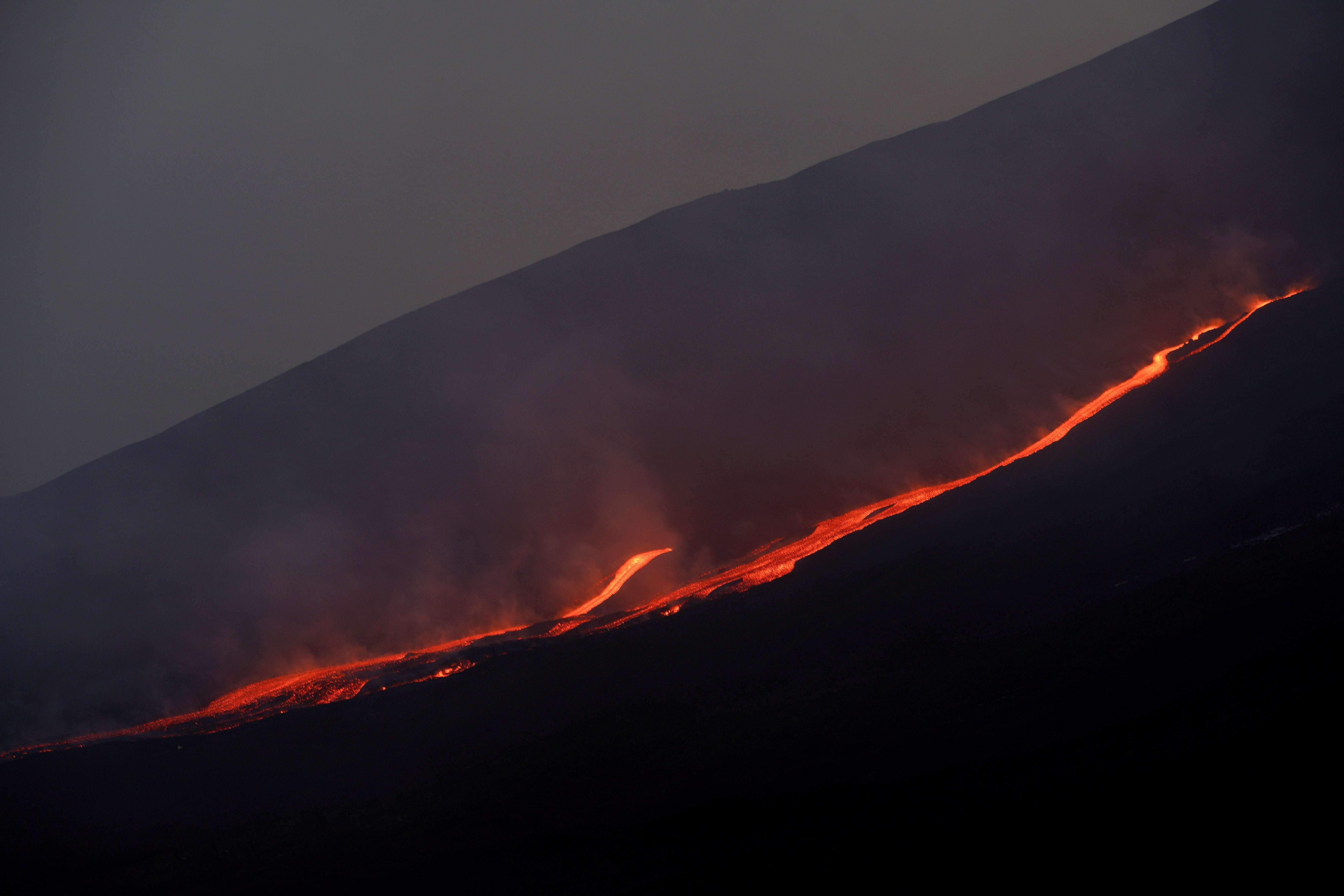 File image shows lava flowing down Mount Etna’s slopes. Sicily is home to Europe’s most active volcano, though there hasn’t been a deadly, major eruption since 1922