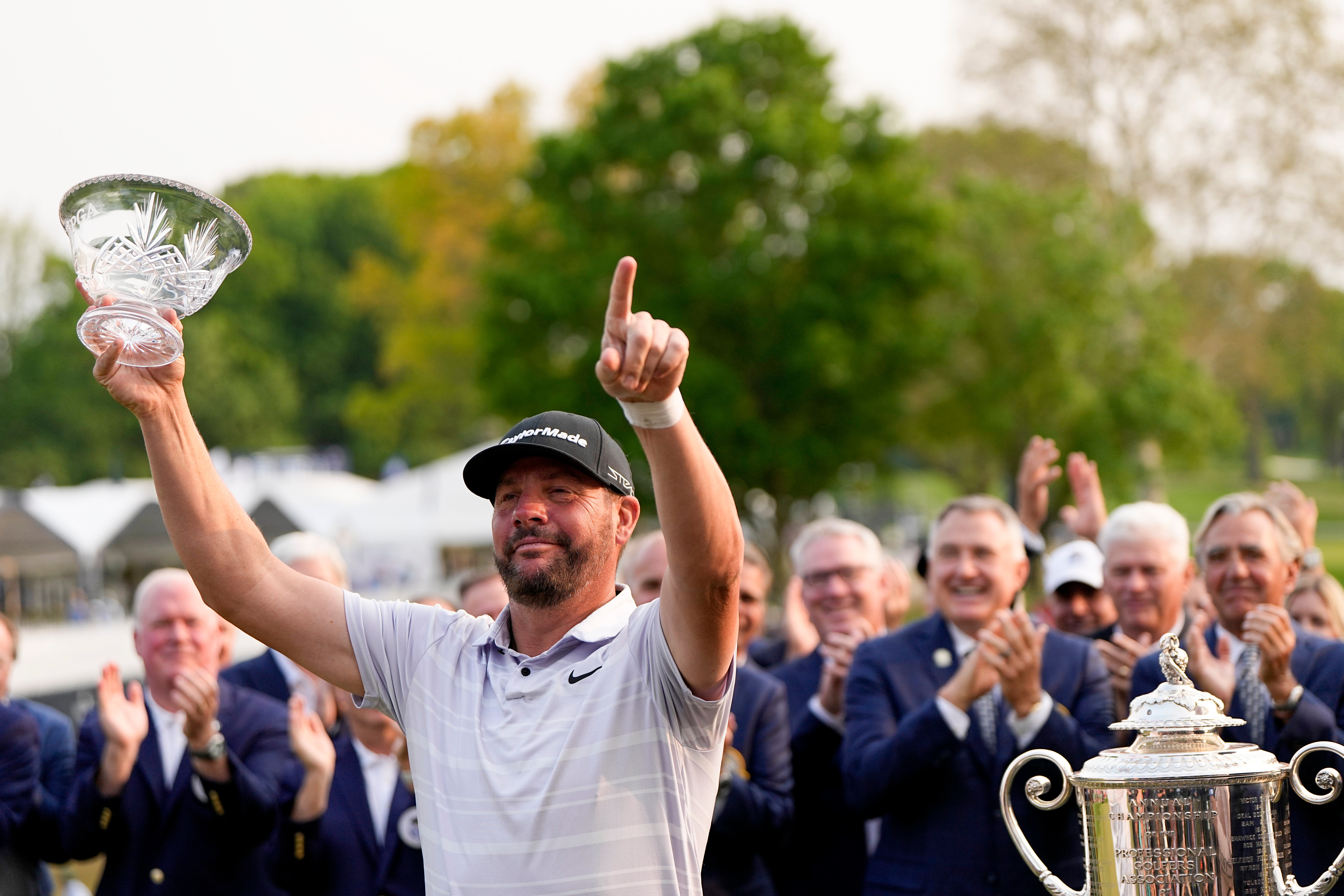 Michael Block poses with the crystal bowl he won for being the low club professional at the US PGA Championship (Eric Gay/AP)