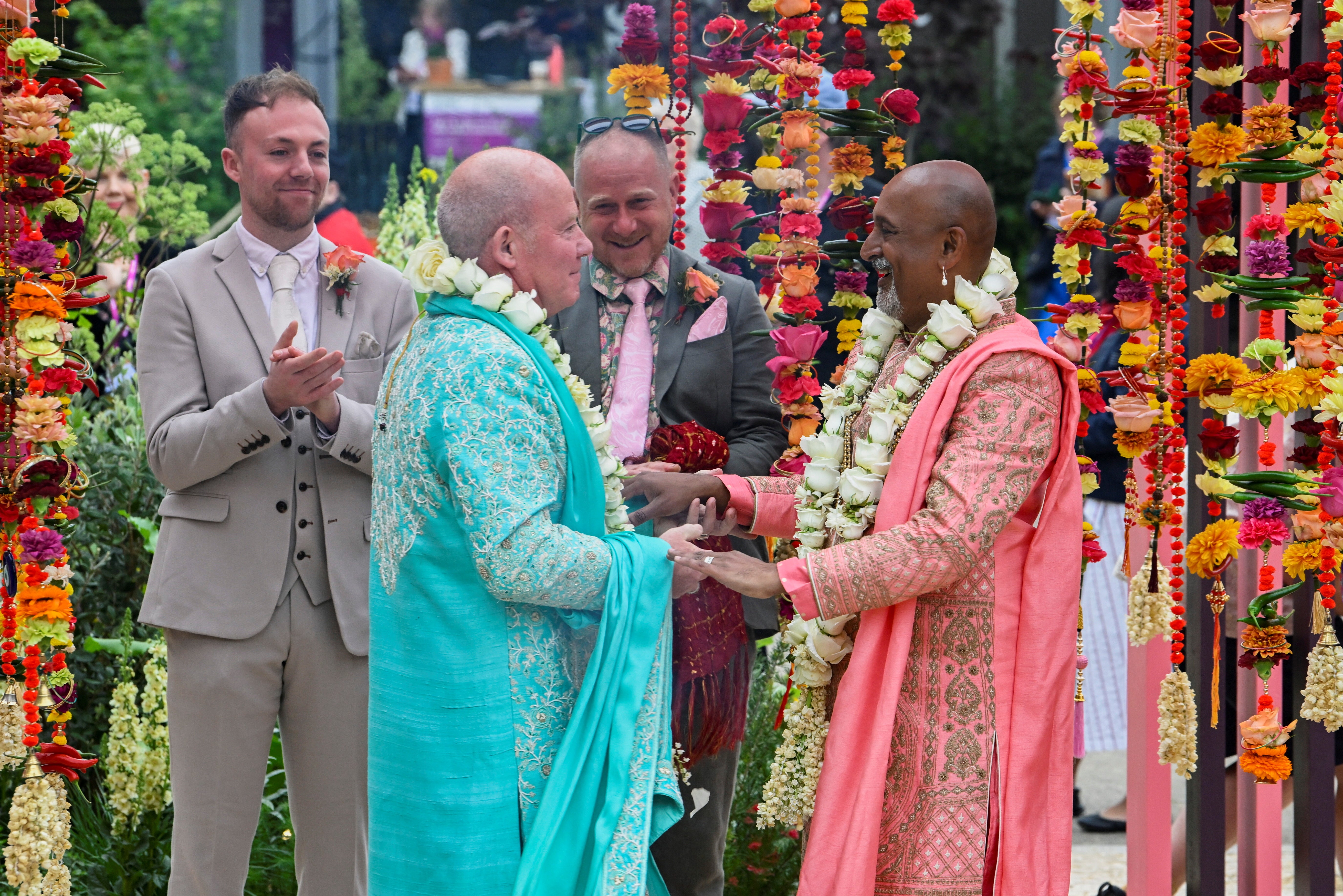 Manoj Malde and Clive Gillmor marry in a civil wedding ceremony at the RHS and Eastern Eye Garden of Unity, the first wedding to take place at Chelsea Flower Show in London