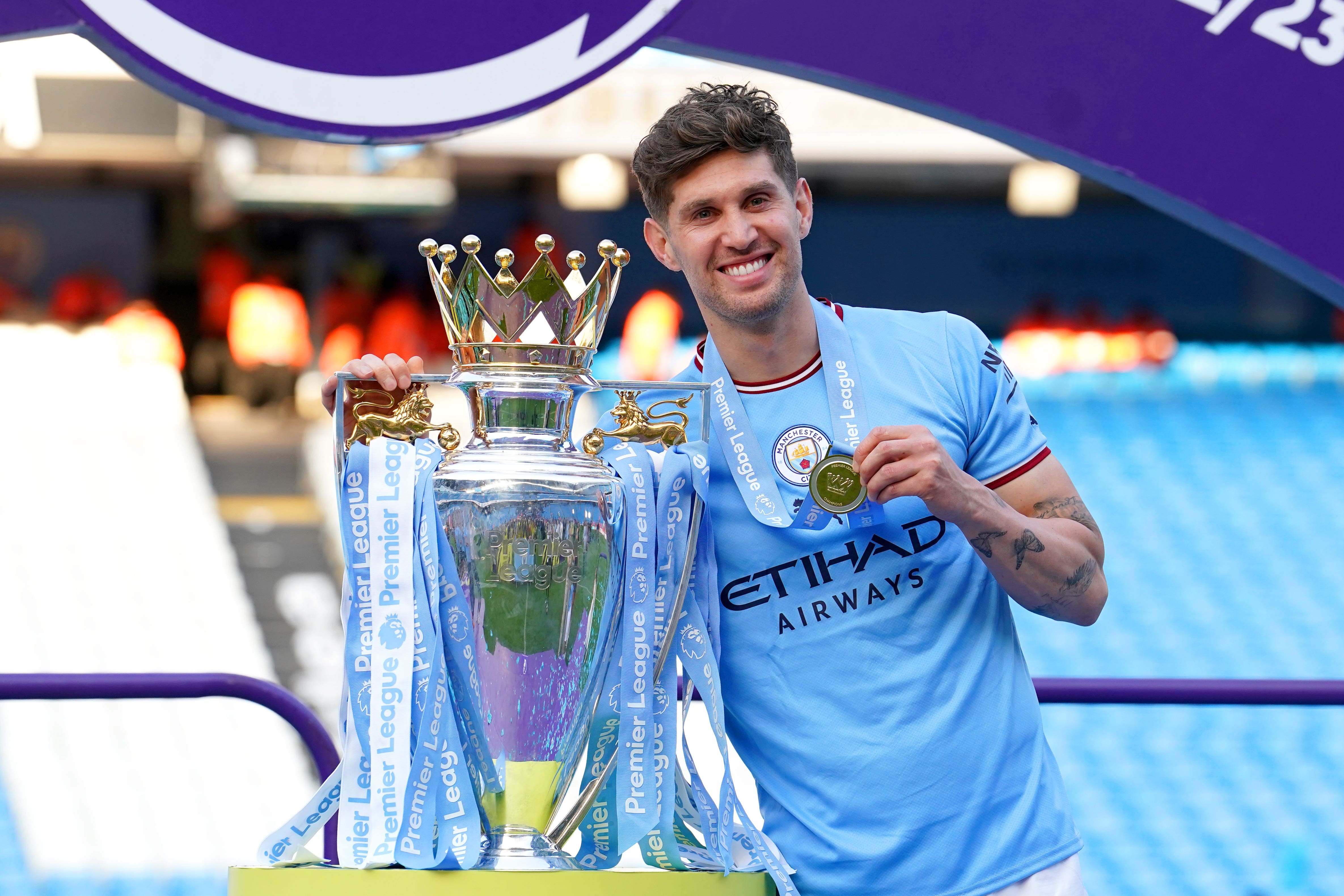 John Stones is celebrating his fifth Premier League title (Martin Rickett/PA)