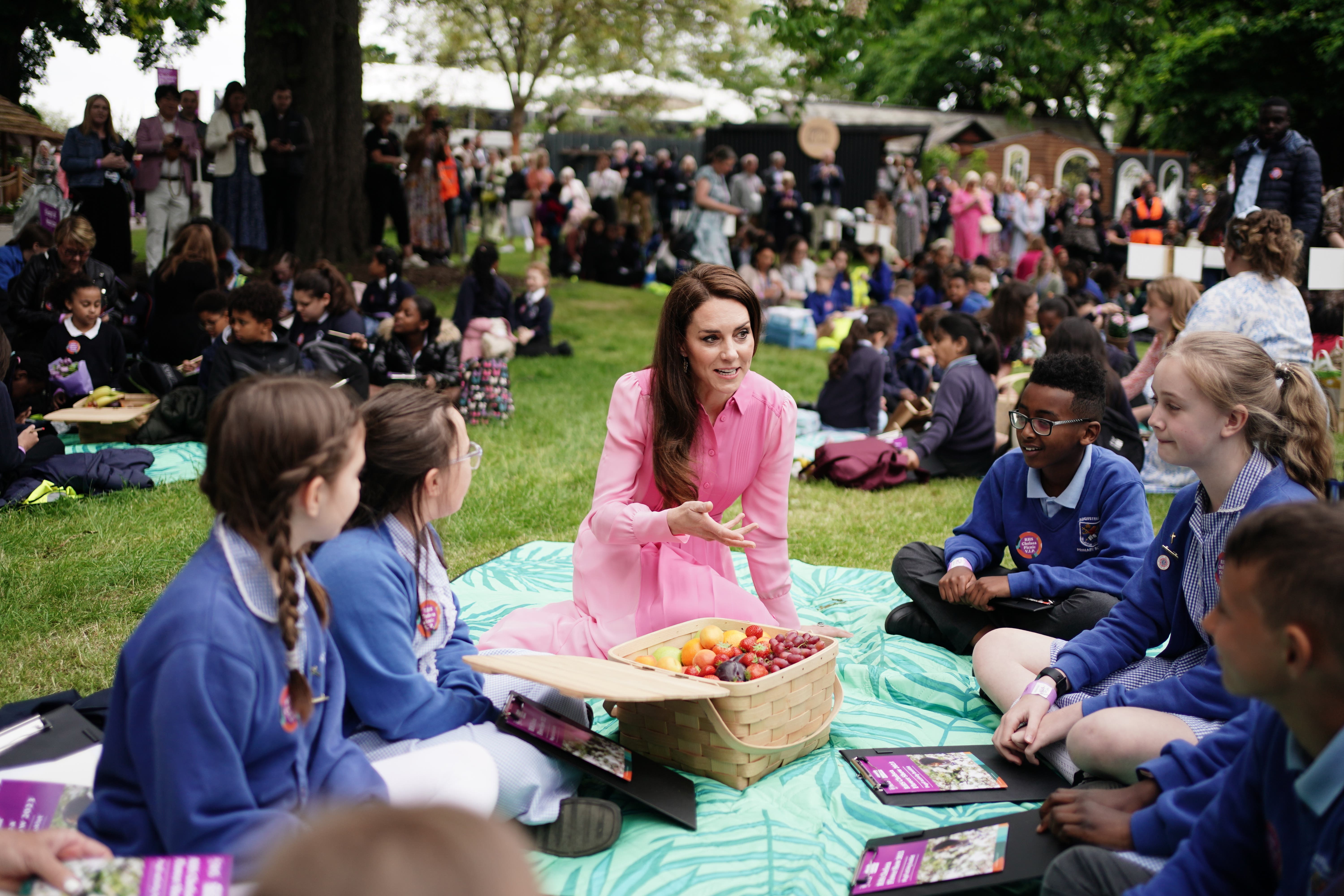 The Princess of Wales with pupils at the first children’s picnic at the RHS Chelsea Flower Show (Jordan Pettitt/PA)