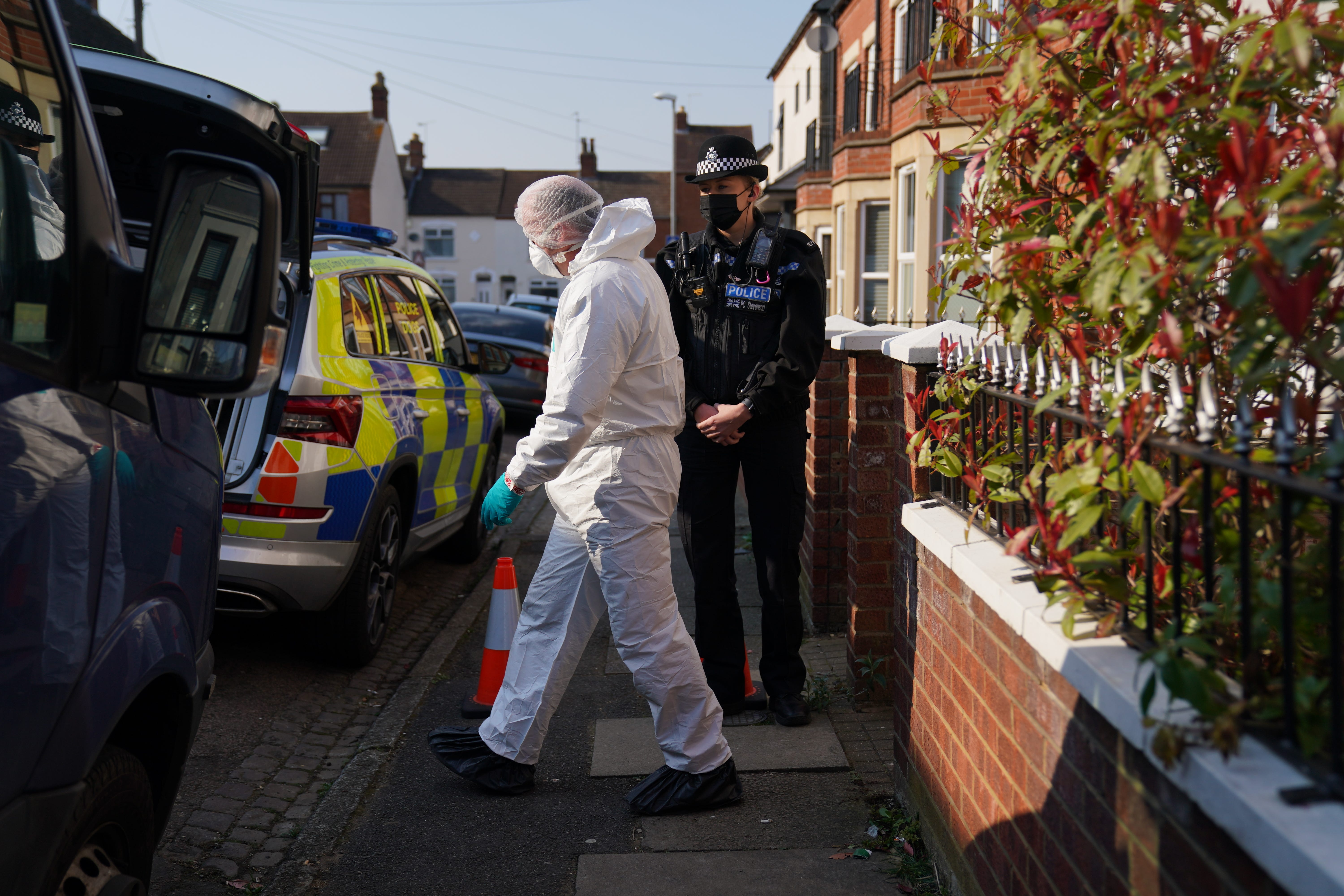 Forensic officers at the scene in Moore Street, Kingsley, Northampton (Jacob King/PA)