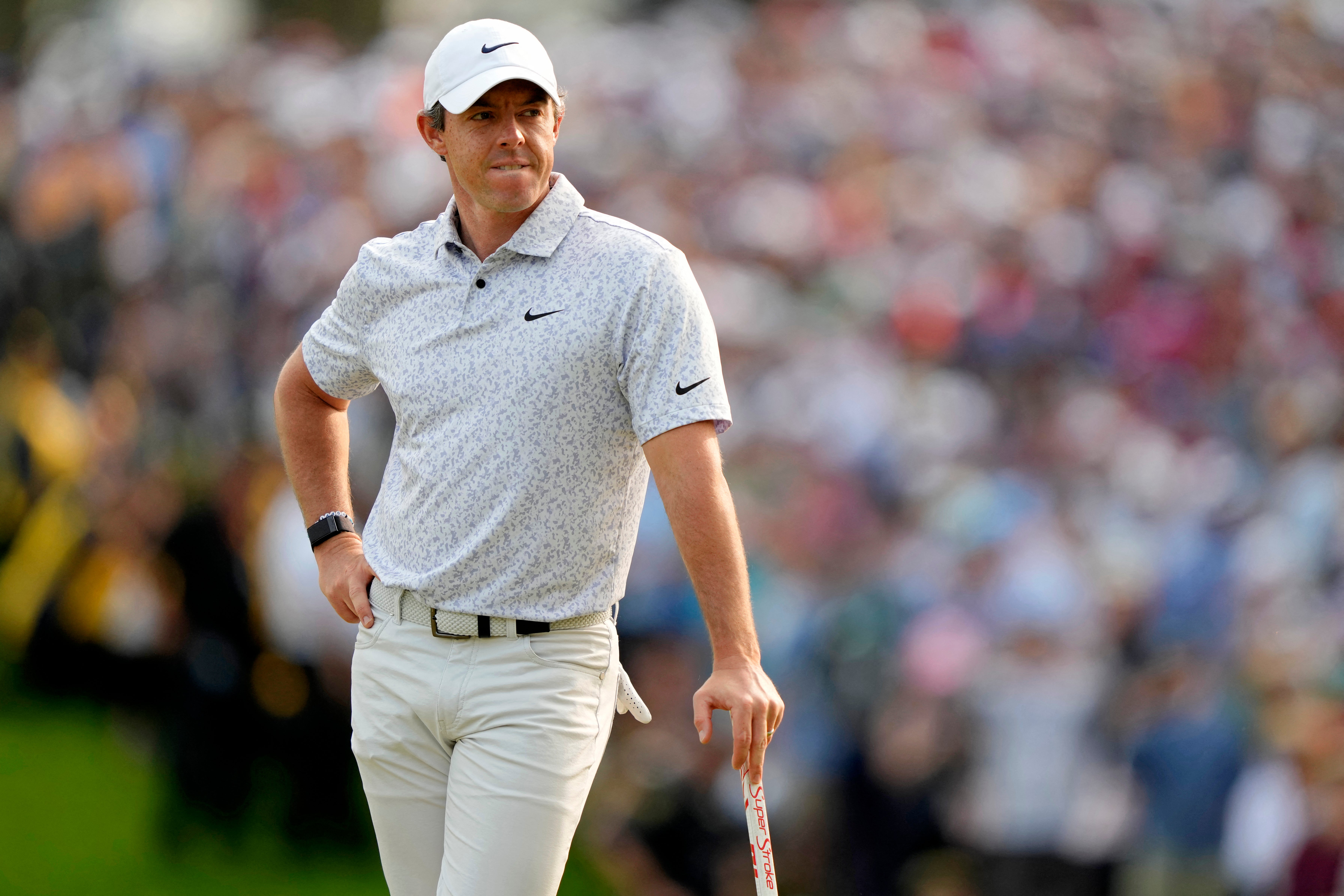 Rory McIlroy waits to putt on the 18th green at Oak Hill Country Club on Sunday