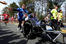 Rick Hoyt, who became a Boston Marathon fixture with father pushing wheelchair, has died at 61