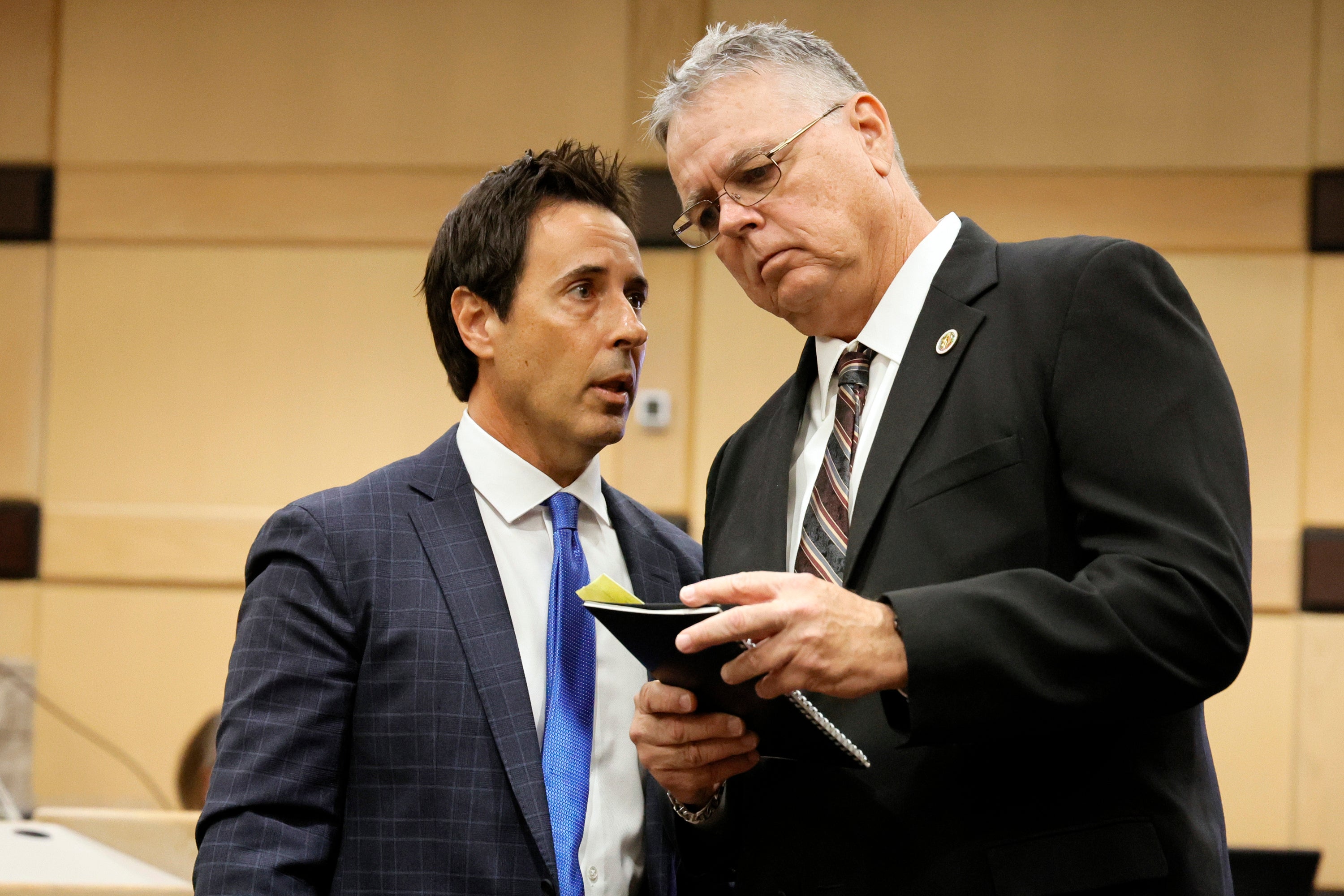 Peterson, right, speaks with his defence lawyer Mark Eiglarsh following a hearing in his case at the Broward County Courthouse