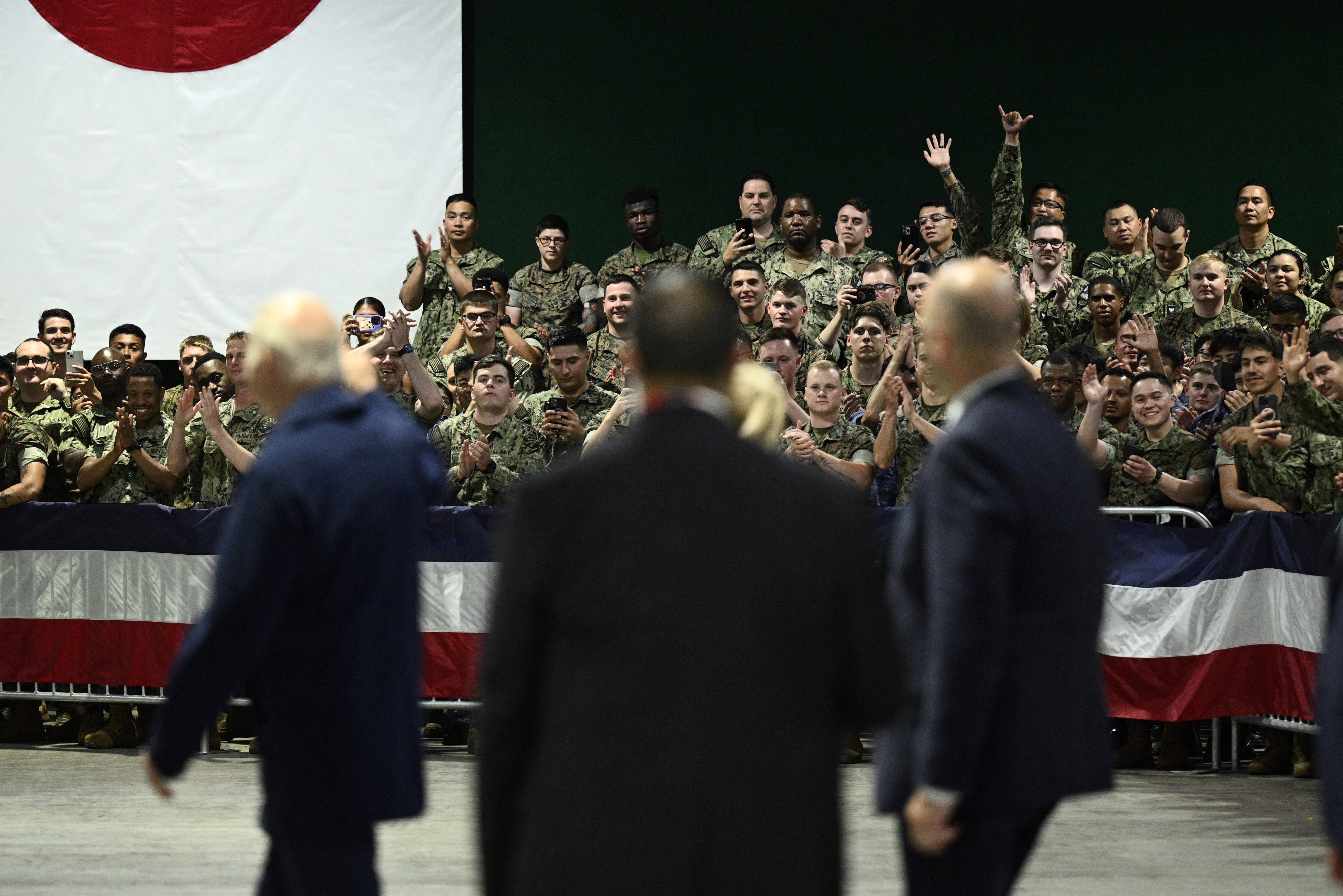 Joe Biden greeting US soldiers at the US Marine Corps base in Iwakuni