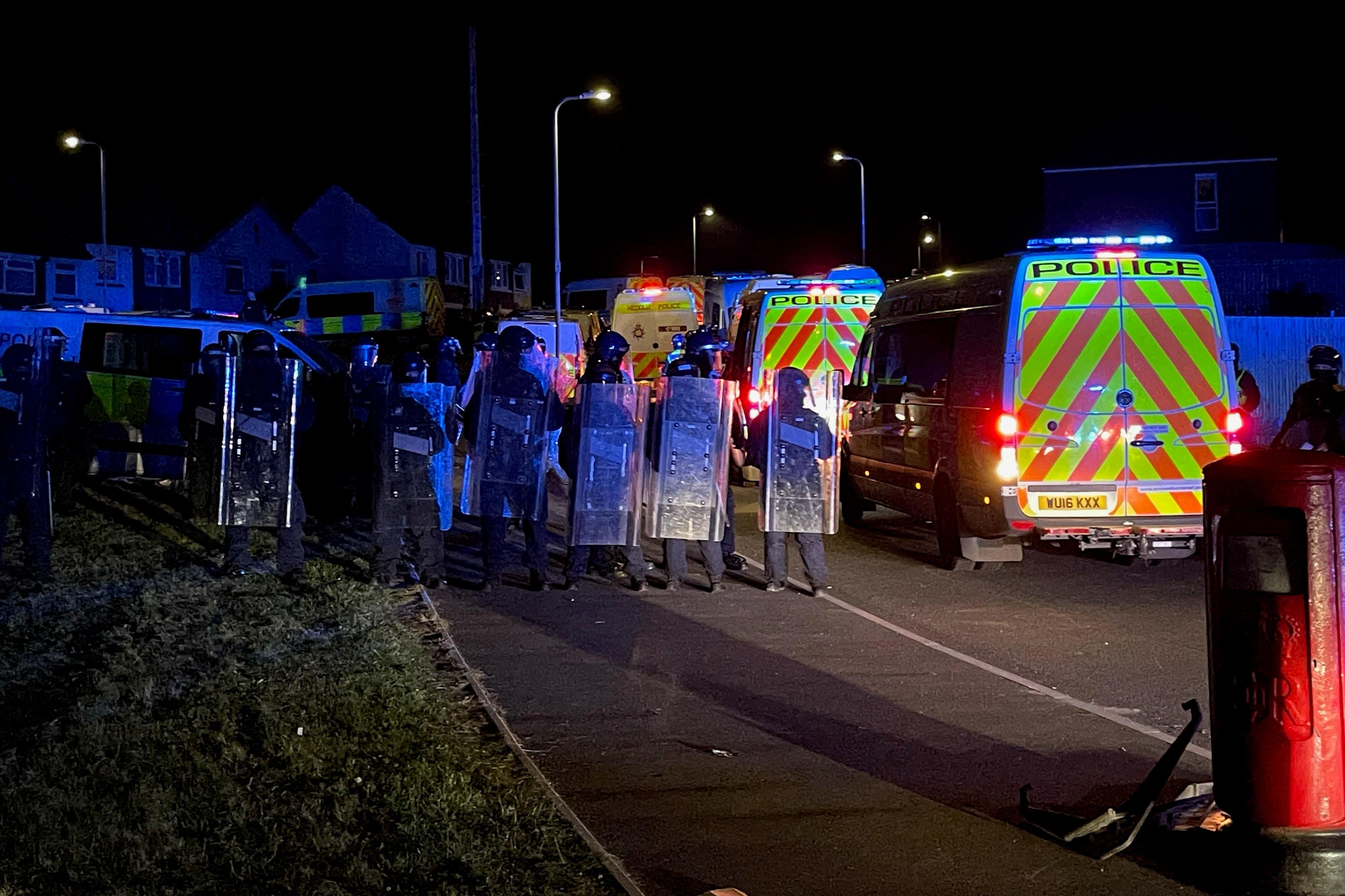 Police officers on Wilson Road in Cardiff as they face “large scale disorder” at the scene of a serious road traffic collision (Bronwen Weatherby/PA Wire)