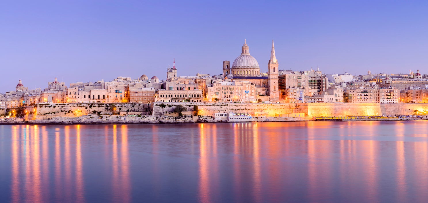 The harbour and St. Paul's Anglican Cathedral, along with the Carmelite Church at Valetta