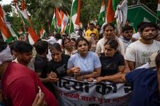 Indian wrestlers hold candlelight march demanding arrest of sports official for sexual abuse