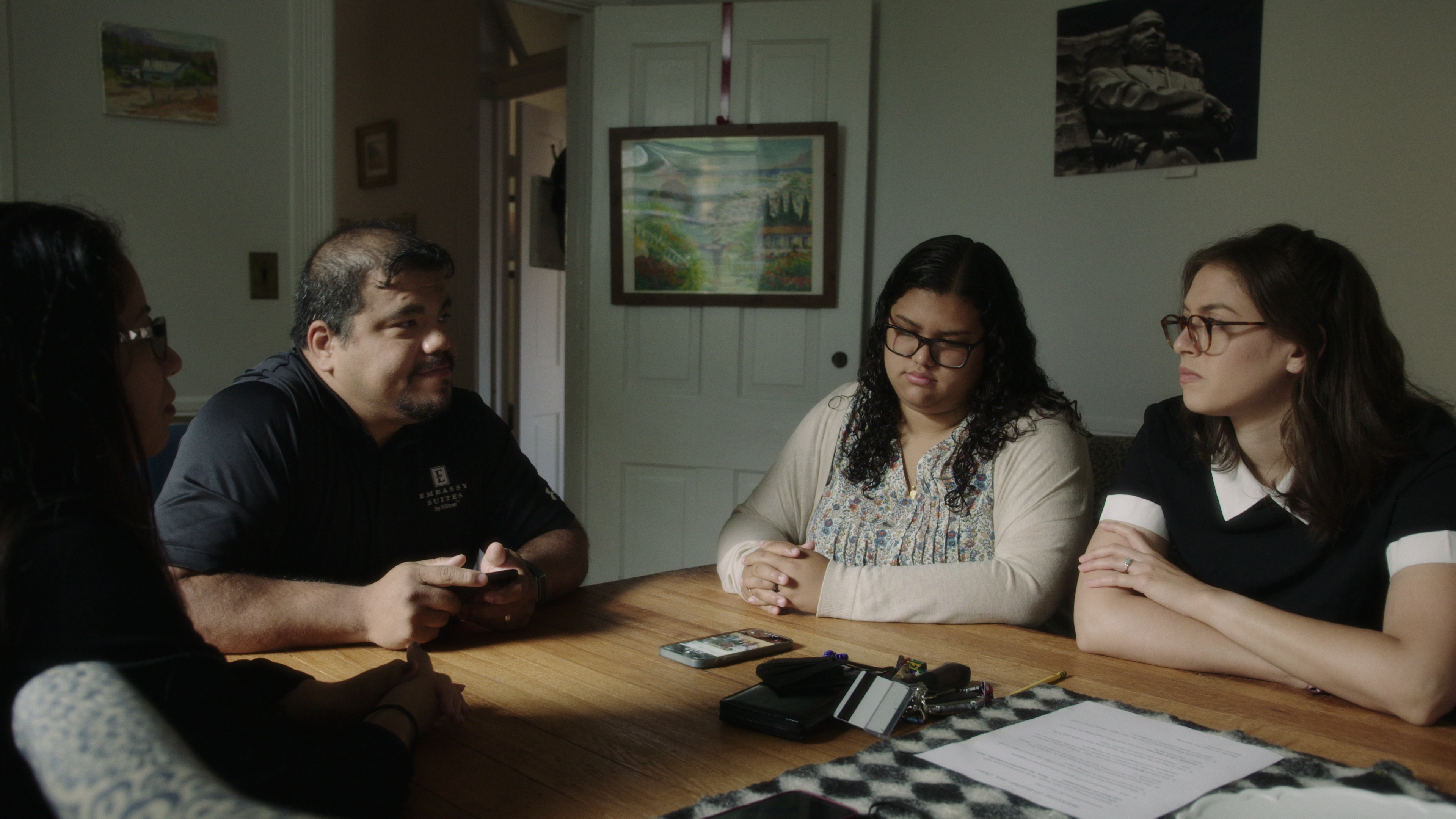 Dyanie Bermeo (third from left) and Rachel de Leon (right) sit down with Bermeo’s parents, Karla Cardenas and Gabe Bermeo