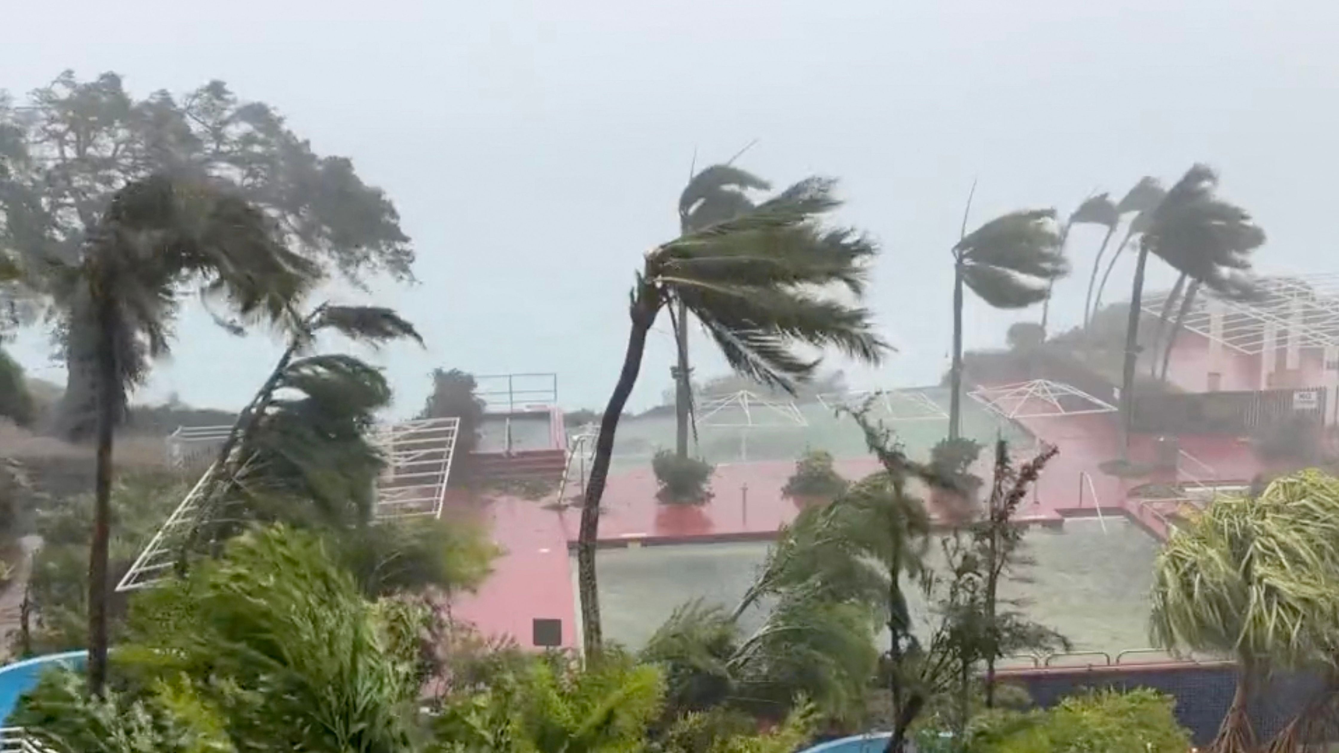 This video grab from the Twitter page of James Reynolds @EarthUncutTV shows tropical storm force winds blowing across Tumon Bay, Guam