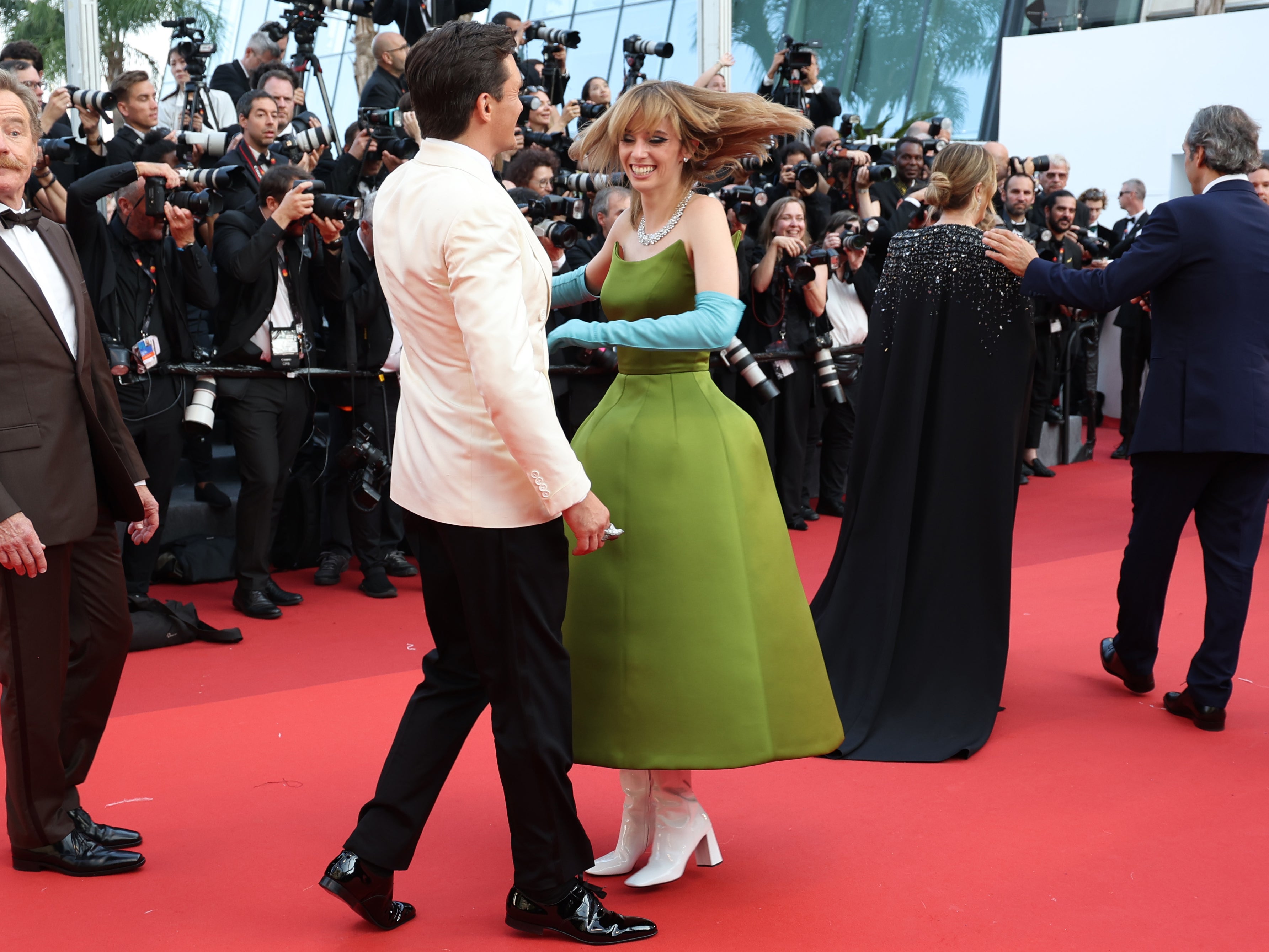 Rupert Friend and Maya Hawke attend the "Asteroid City" red carpet during the 76th annual Cannes film festival at Palais des Festivals on May 23, 2023