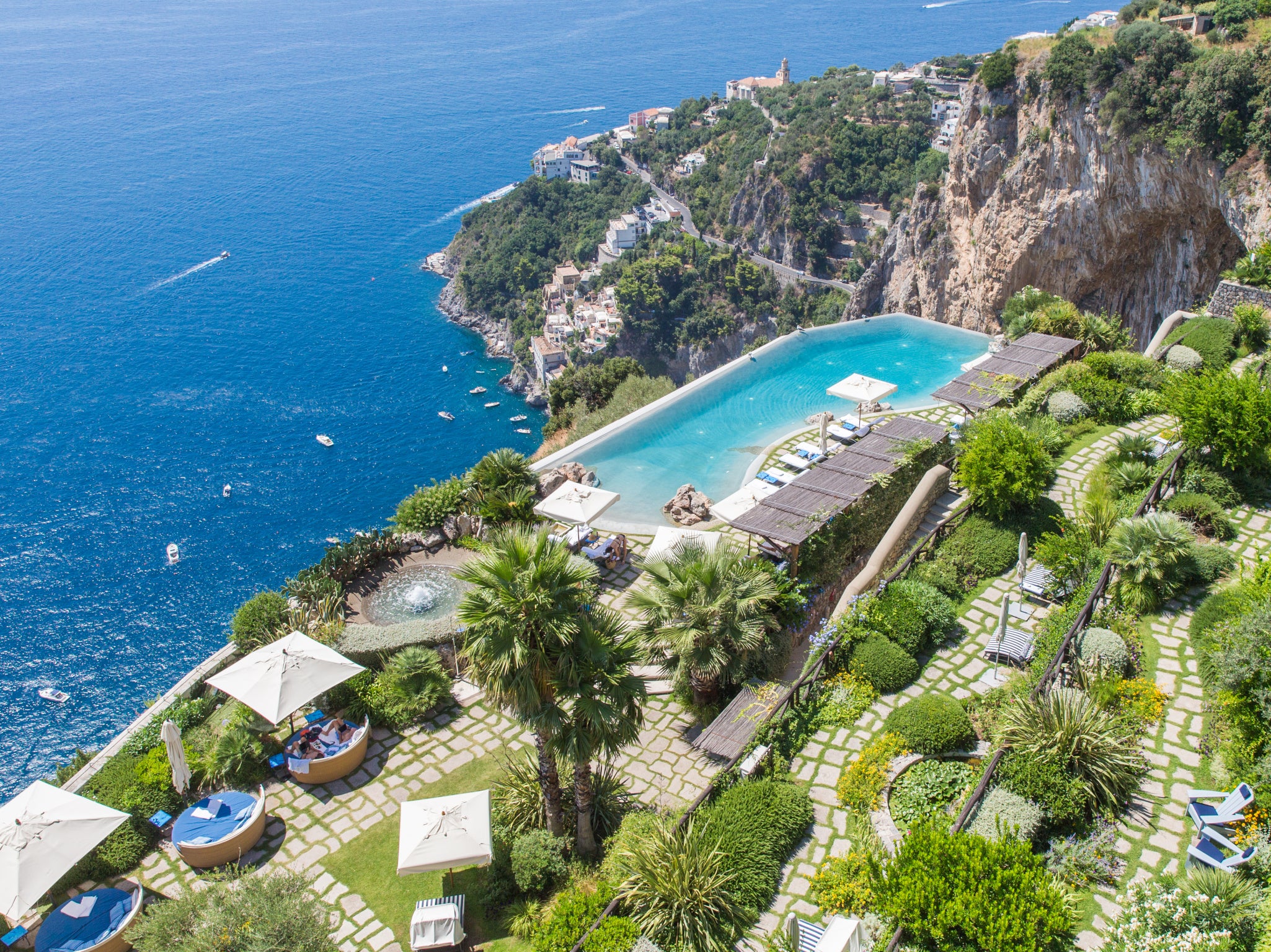 A spectacular infinity pool teeters on the cliff top