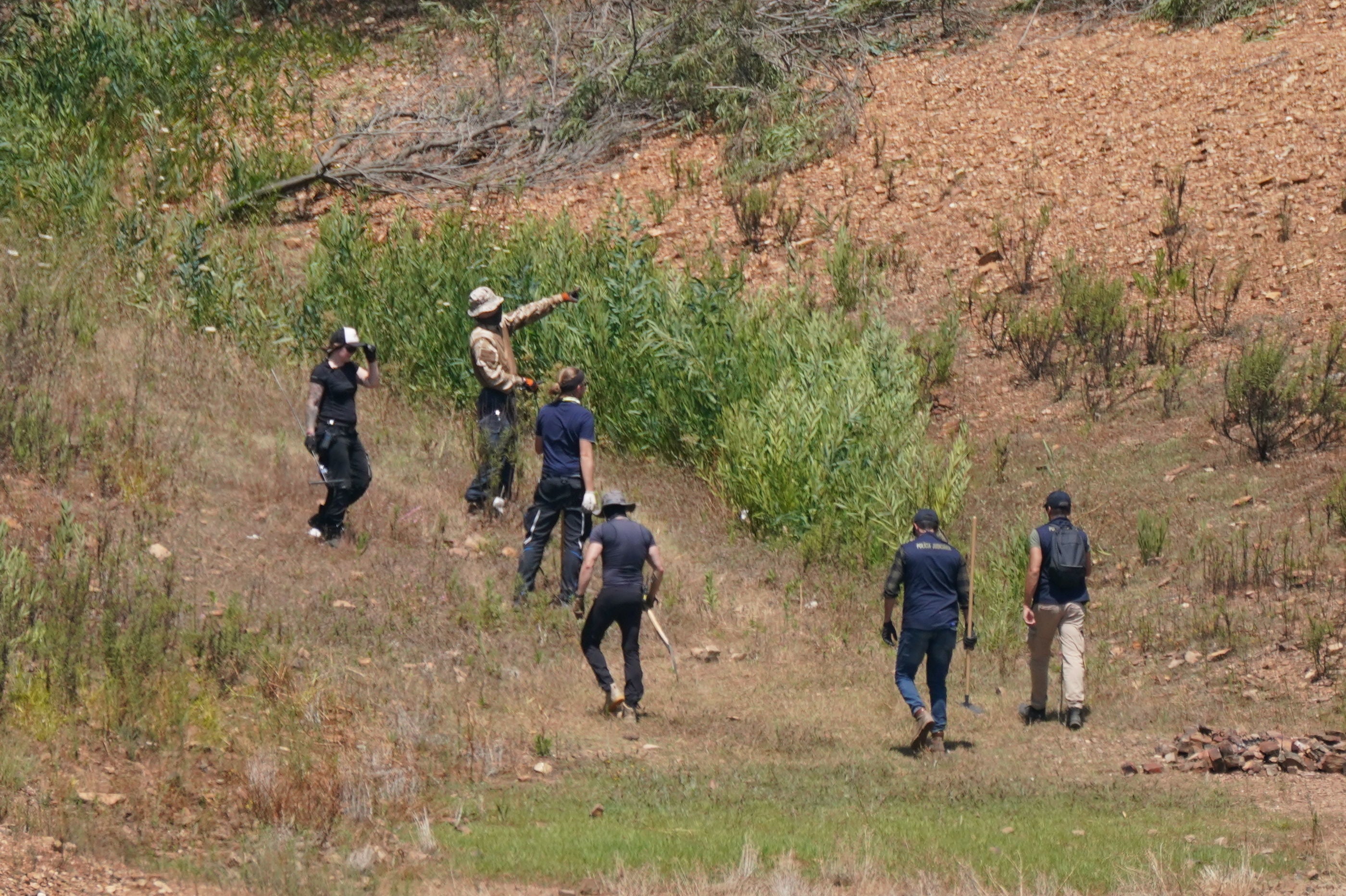 Personnel at Barragem do Arade reservoir, in the Algave, Portugal, as searches took place into the disappearance of Madeleine McCann