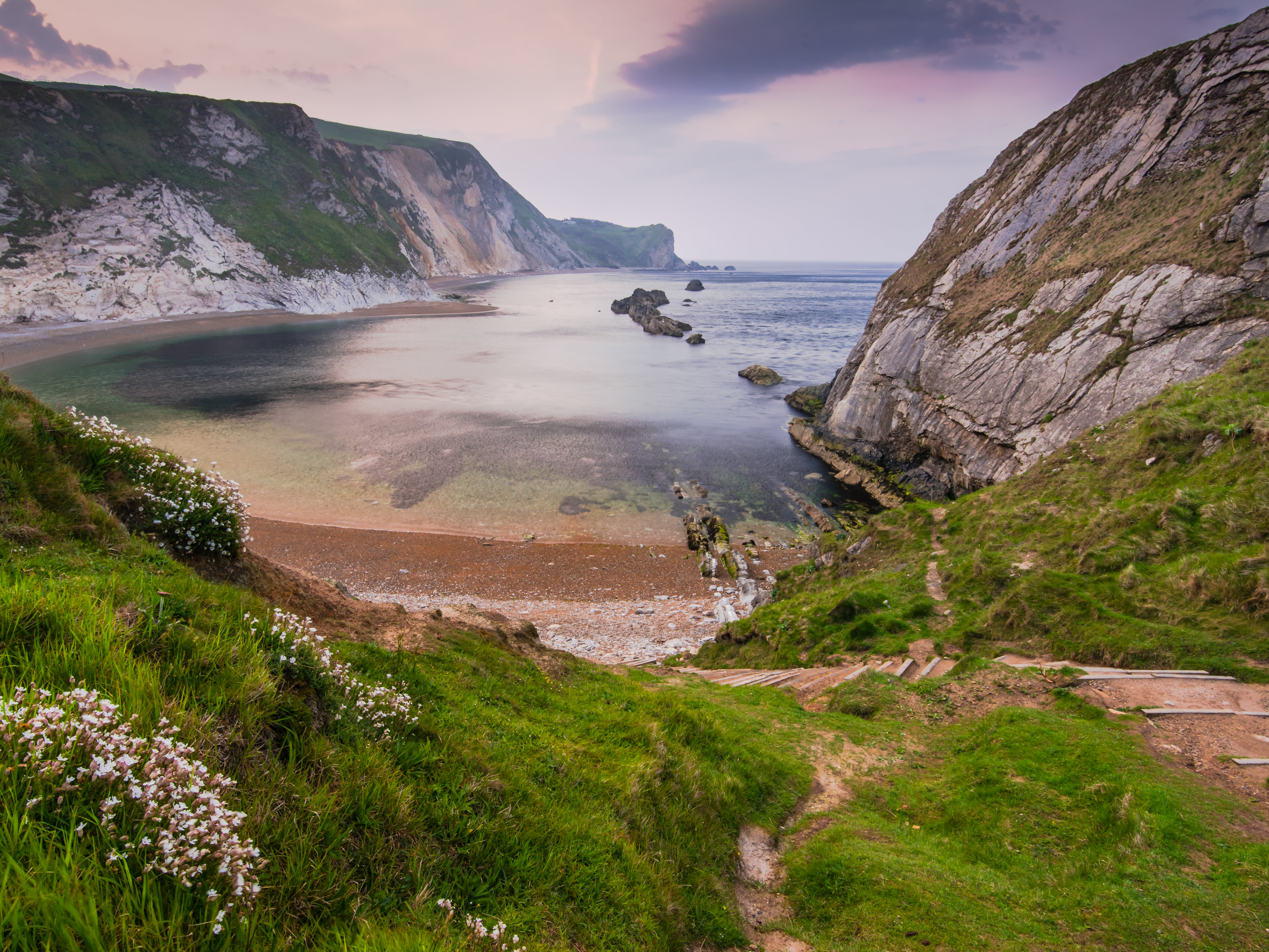 The beach is 15 minutes from the nearest car park and features both sand and pebbles