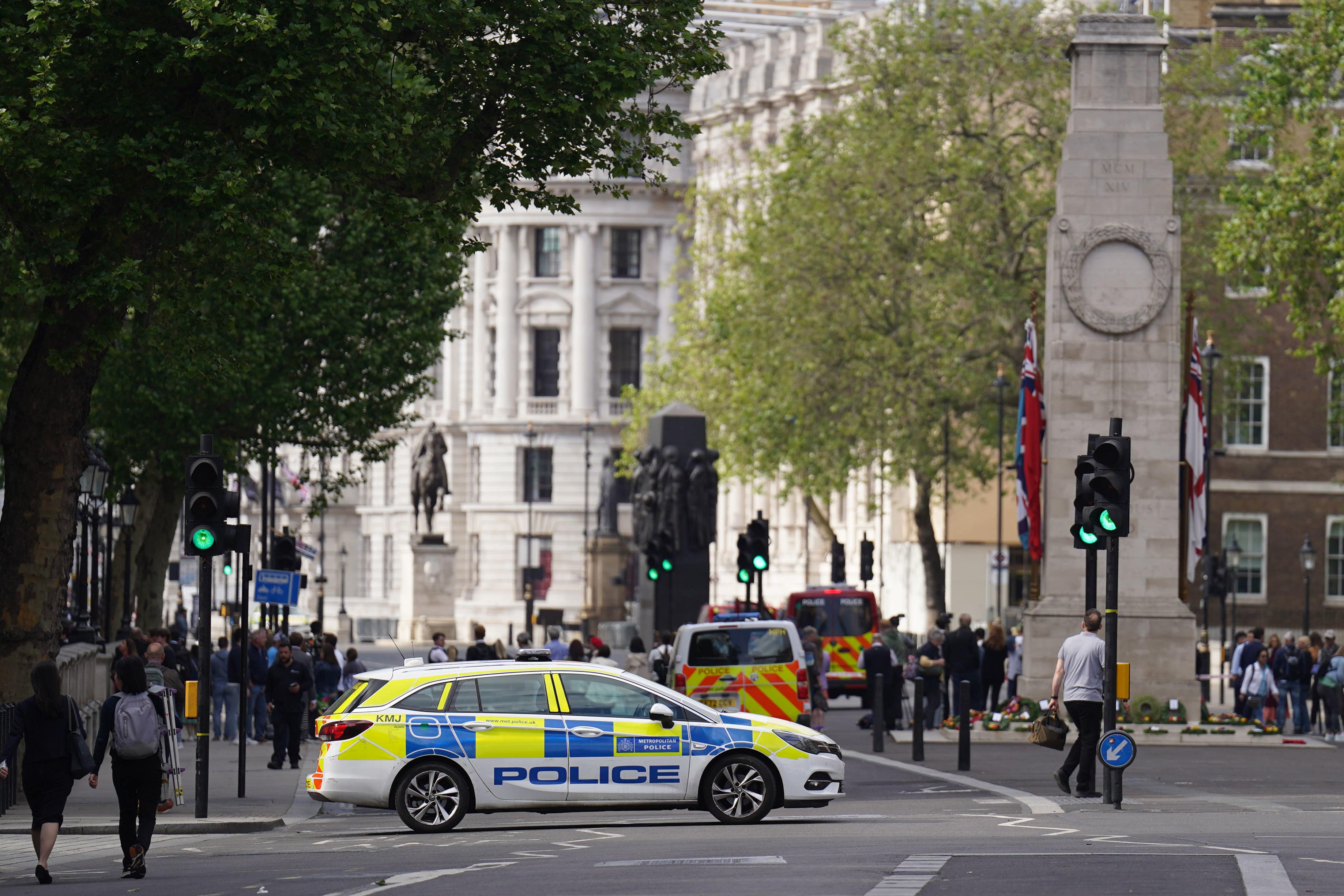 Police at the scene after a car collided with the gates of Downing Street in London.