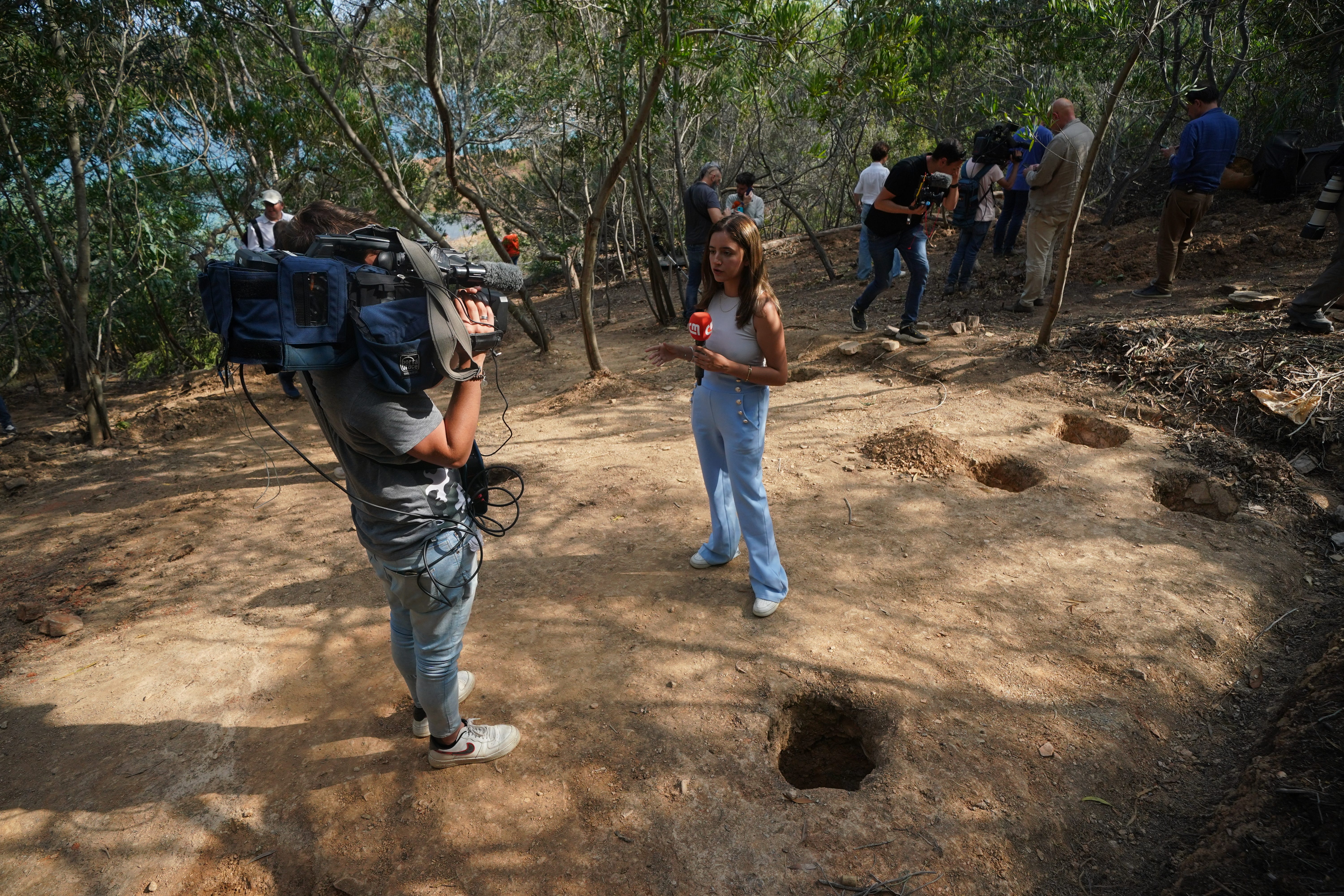 Members of the media at Barragem do Arade reservoir in Portugal after the area was reopened to media (Yui Mok/PA)