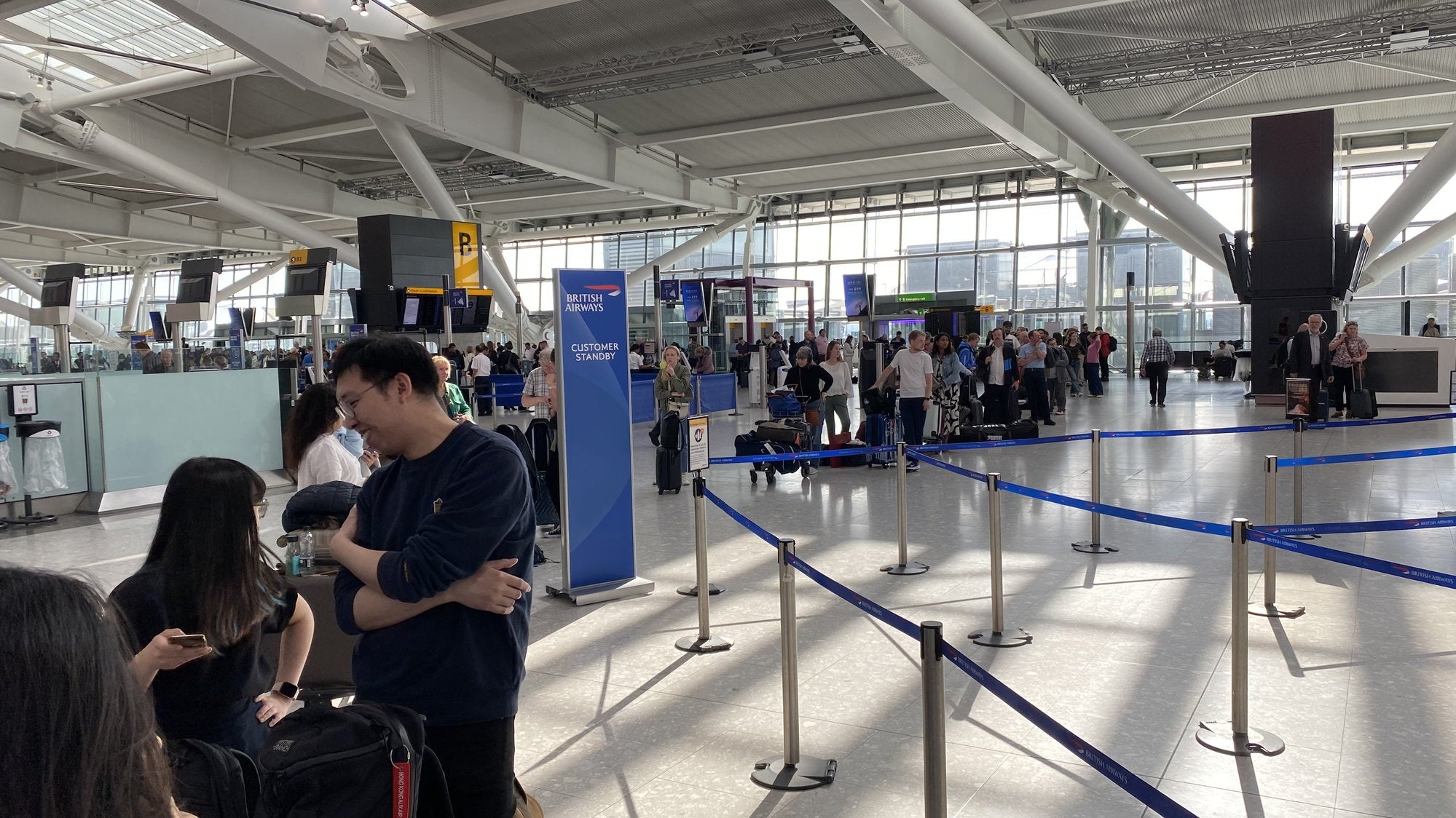 Still long queues at Heathrow Terminal 5 as British Airways customers on cancelled flights wait to be rebooked