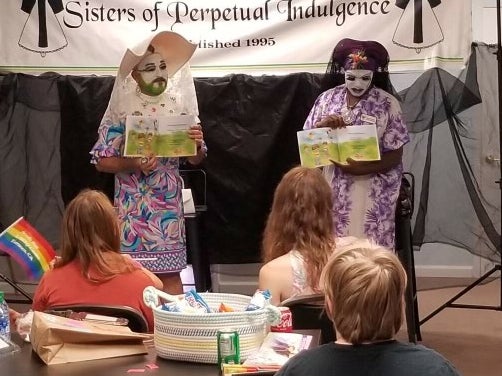 A Sister from the San Francisco chapter, right, models its distinctive “ear boobs” headdress